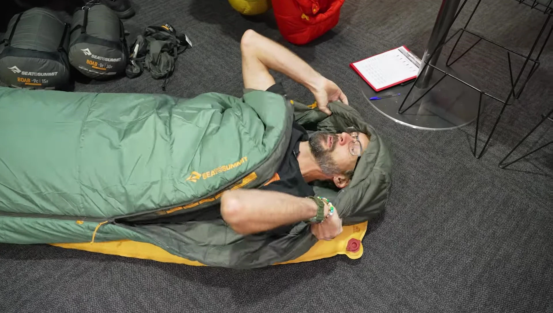 Reviewer demonstrating the hood and zipper functionality.