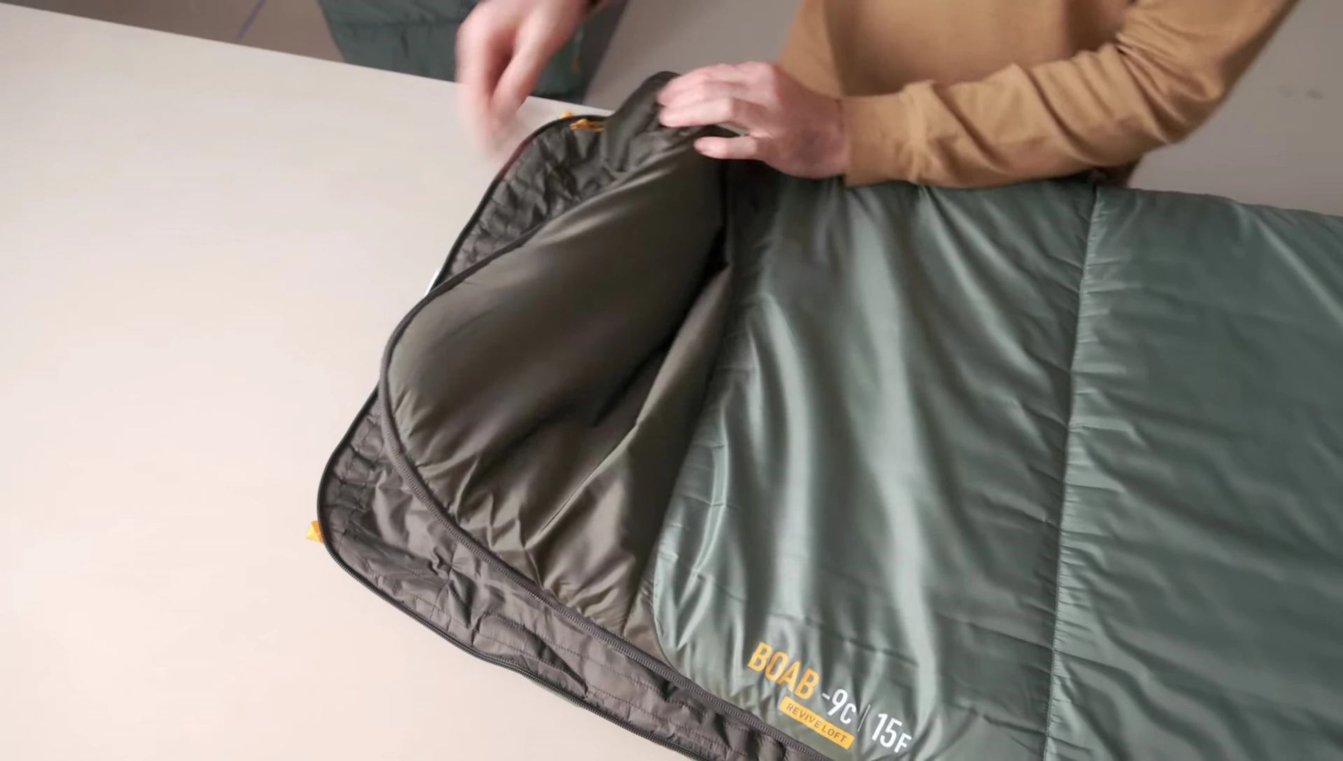 Close-up of the zipper and sliders on the Boab sleeping bag, showing the ventilation options.