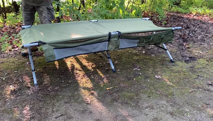 For the head-end bar, place it *underneath* the two long bars instead of forcing it into the bolts. This prevents frustration and makes the cot more comfortable.