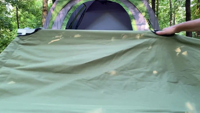 If using a truck tent, lift the cot, place the front legs onto the truck bed, then carefully walk the cot into the truck.