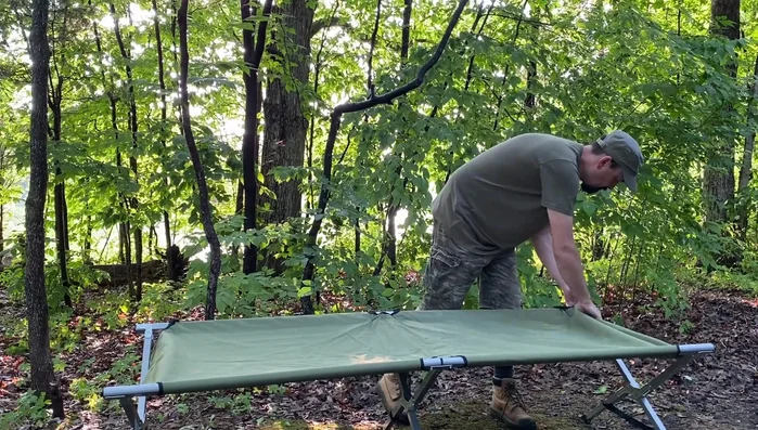 Stretch the fabric taut to ease crossbar insertion.