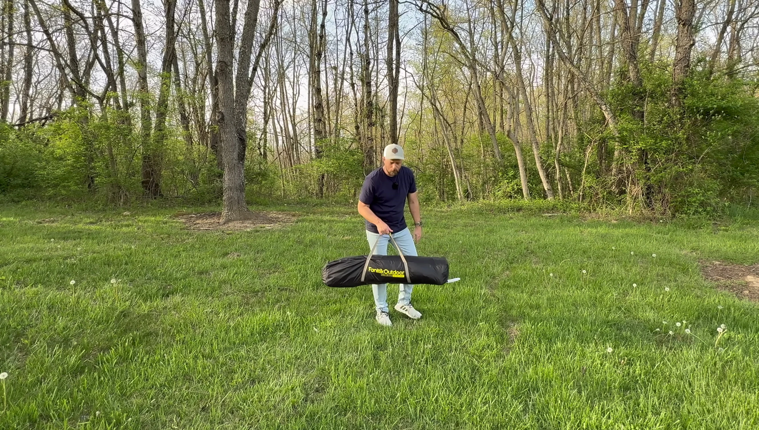 Tent setup beginning, showing the unfolded tent base