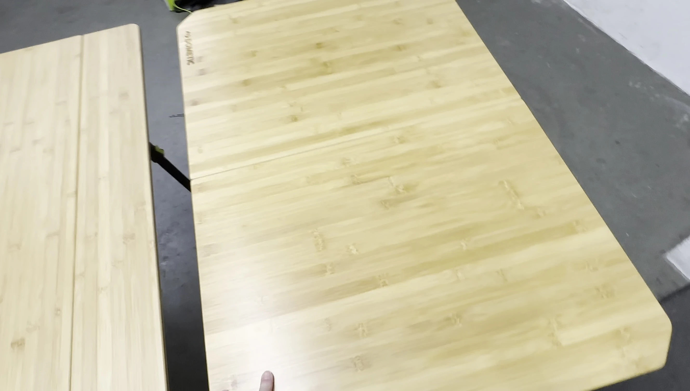 The Zempire table folded in half, showing the larger folded size.