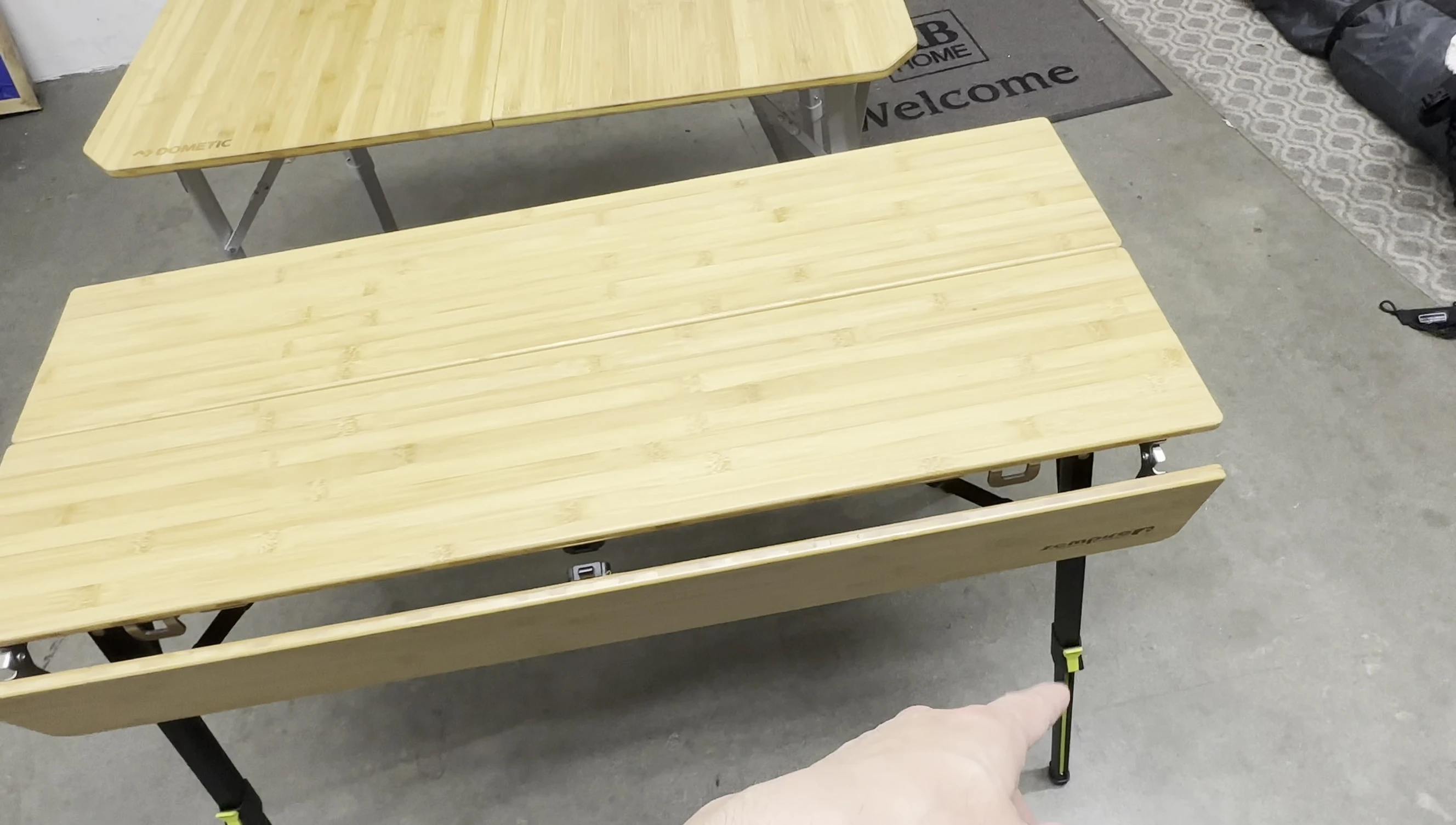 Close-up of the Dometic table showing the neon green adjustment markers.