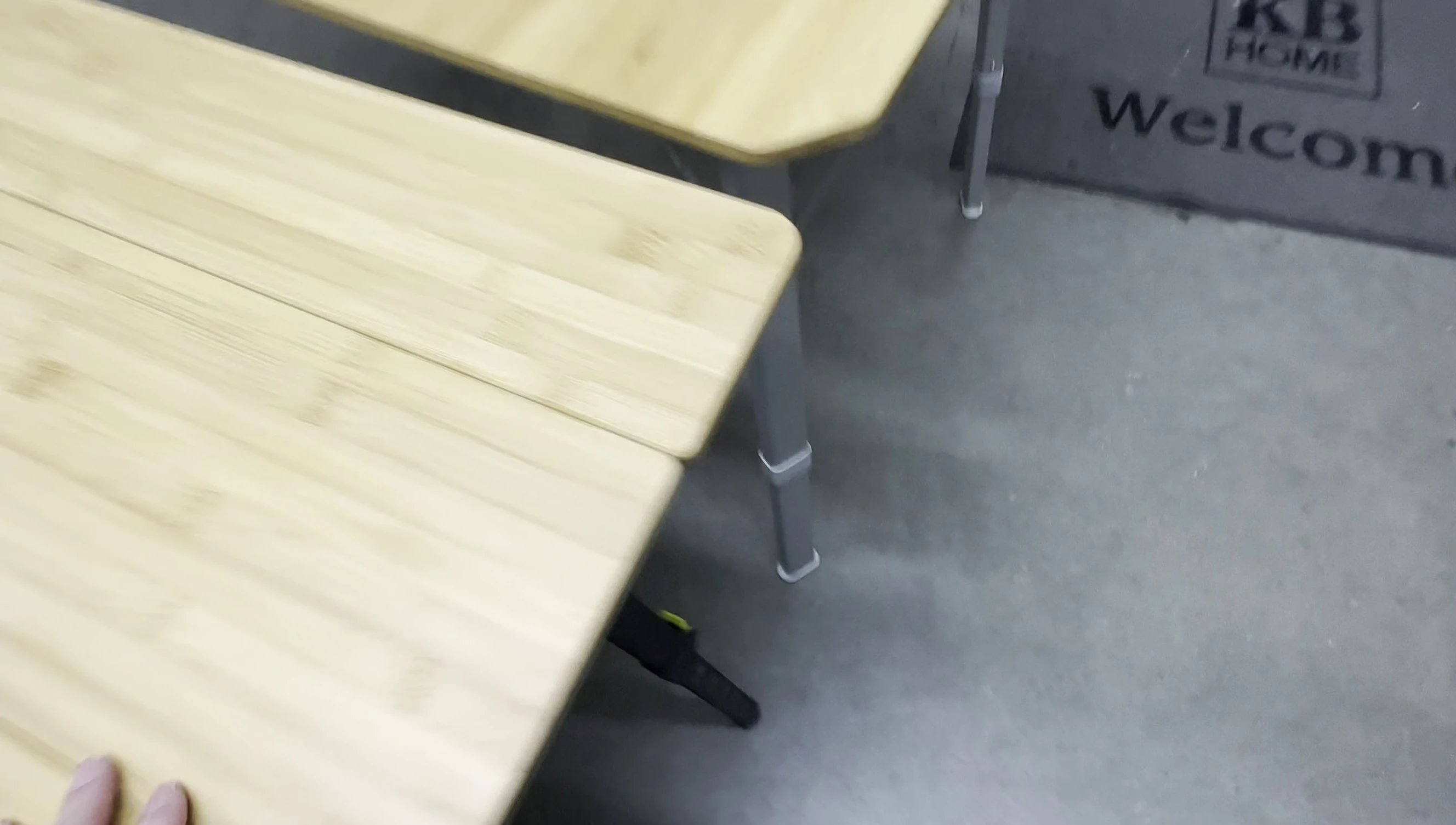 Comparison shot of the legs of both tables, highlighting the thickness difference.