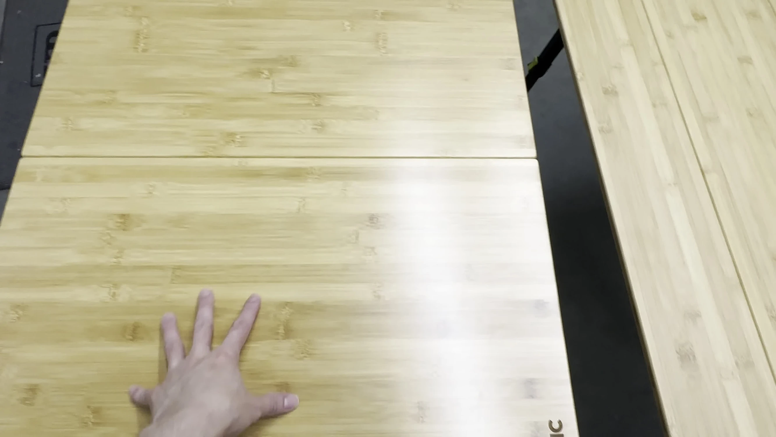 Close-up of the Zempire table folded in half, showcasing the grain.