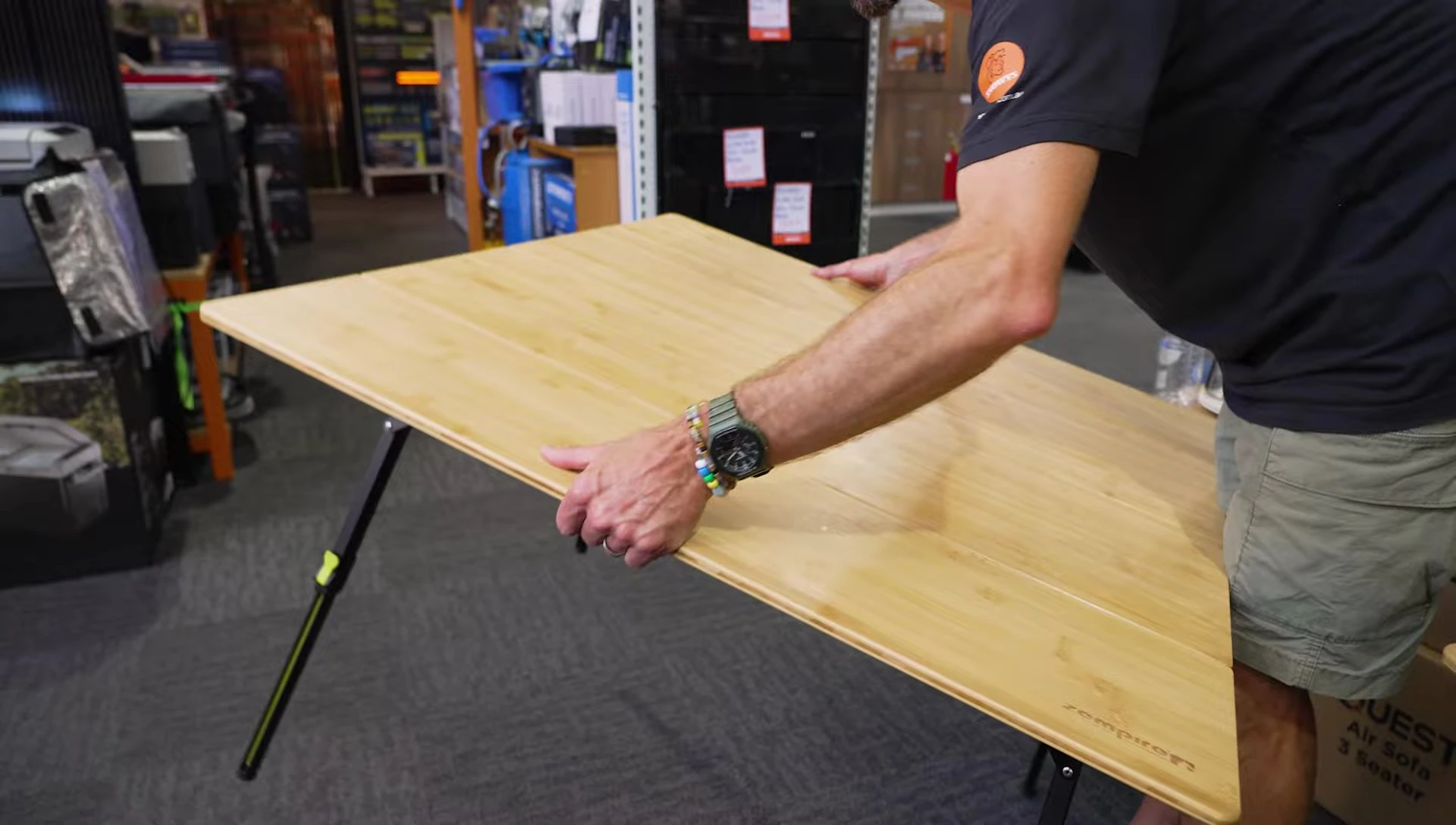 Starting the packing process, showing how to fold the legs and sides.