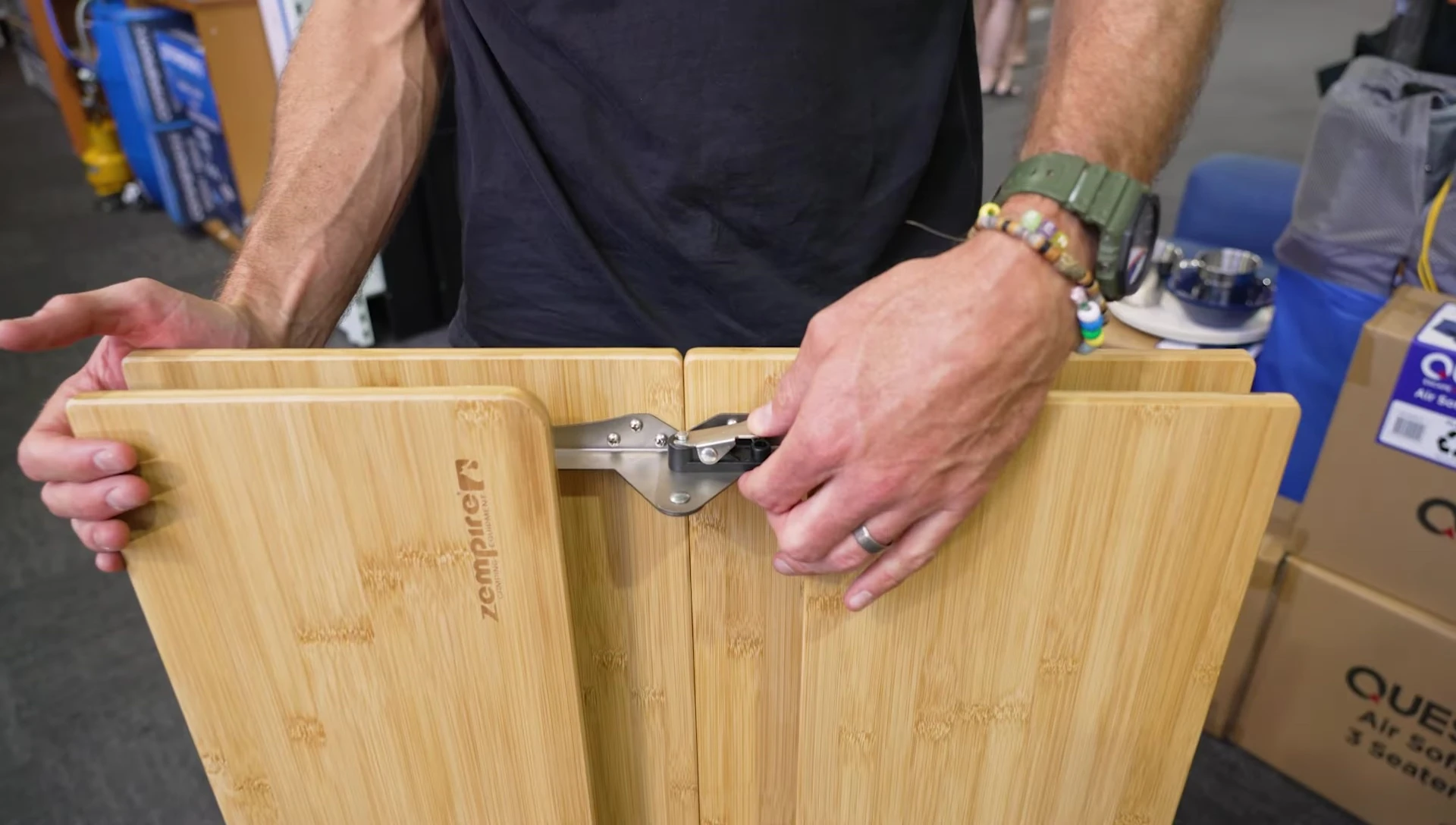 Folding the table frame compactly.