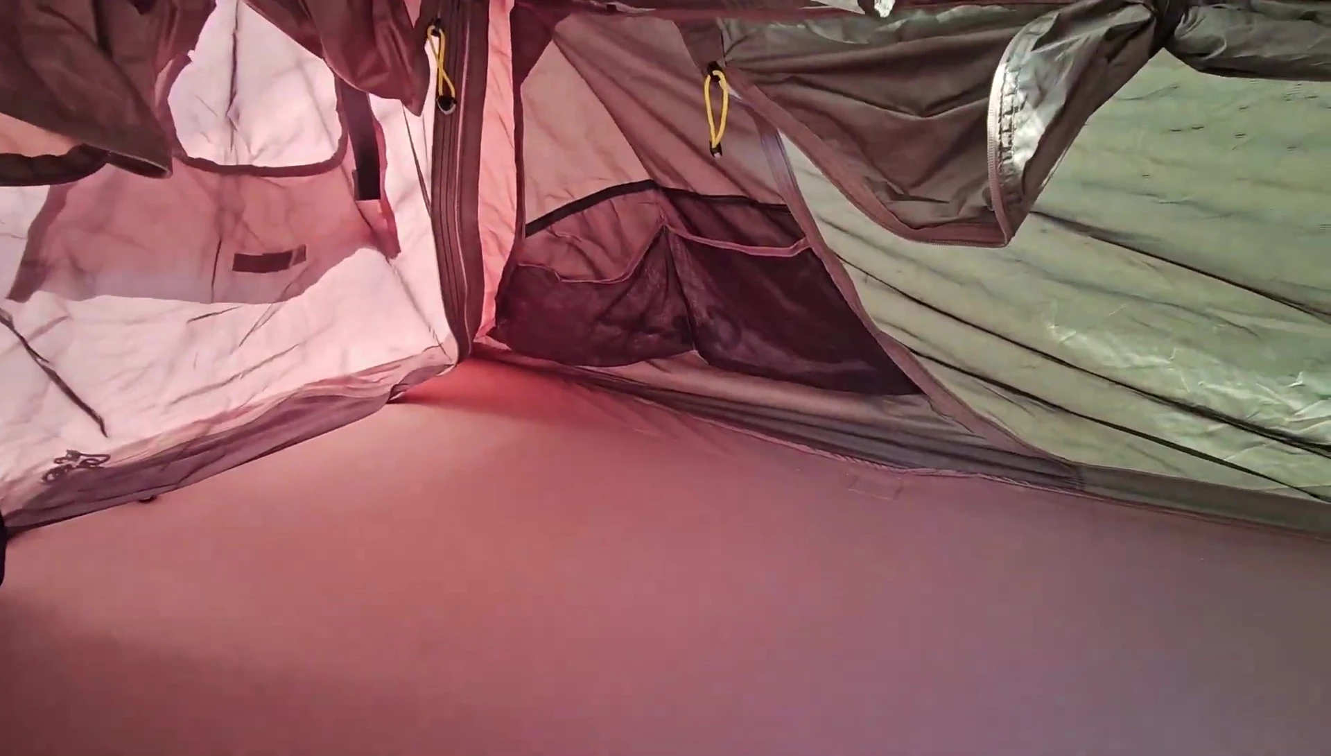 The reviewer inside the cot tent.