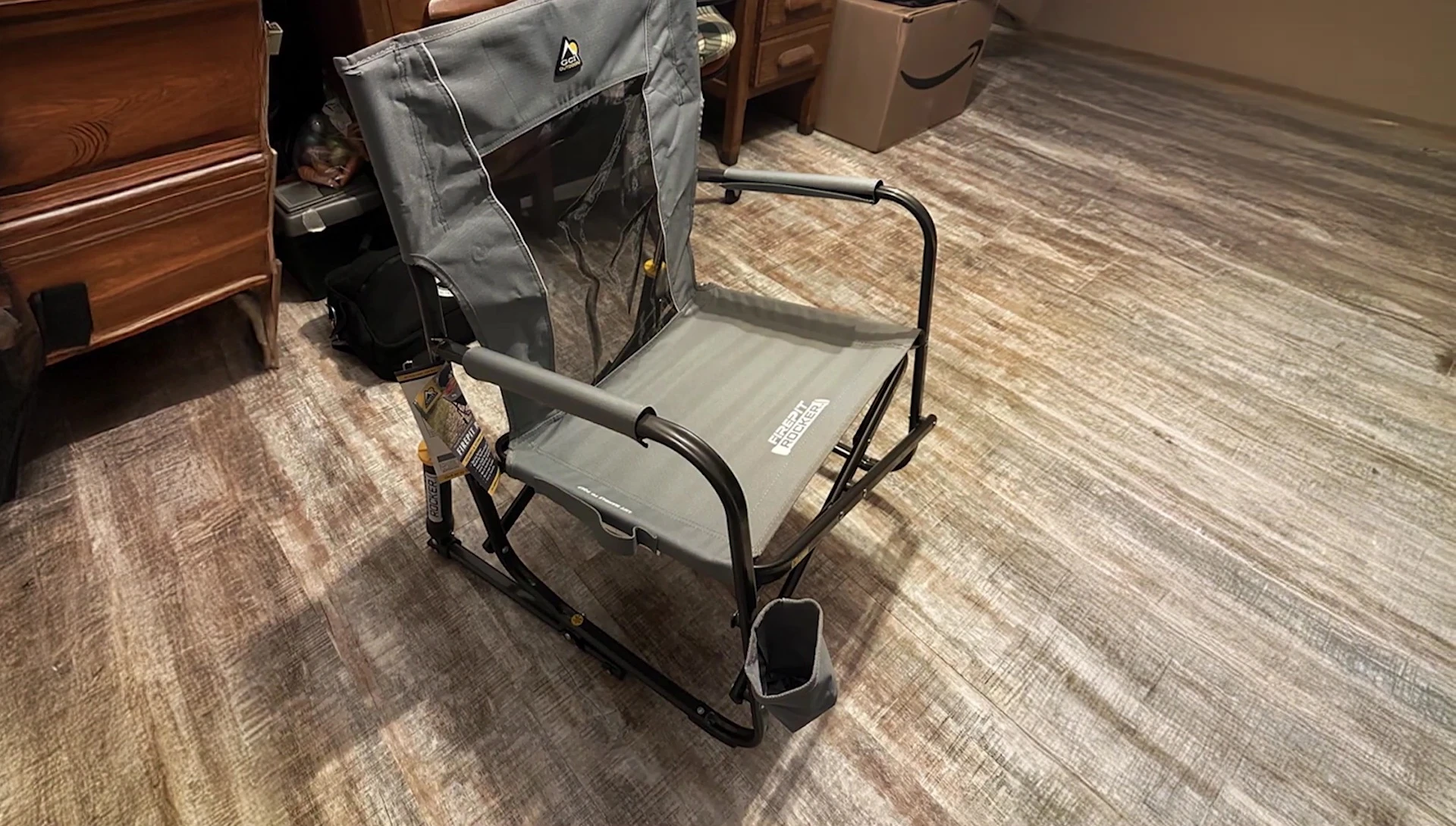 Person relaxing in the GCI Outdoor Freestyle Rocker Chair