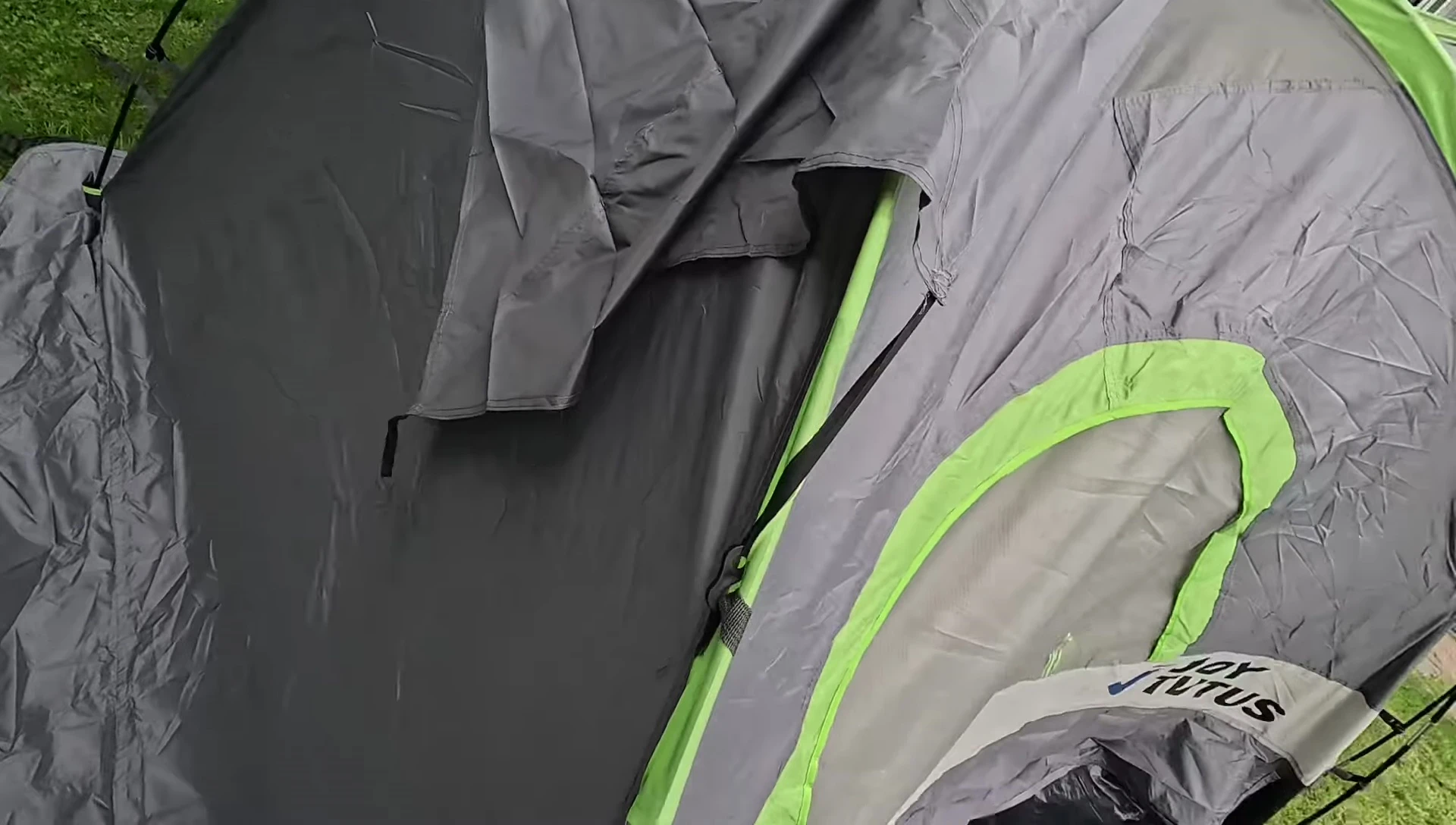 Person assembling the top section of the tent.