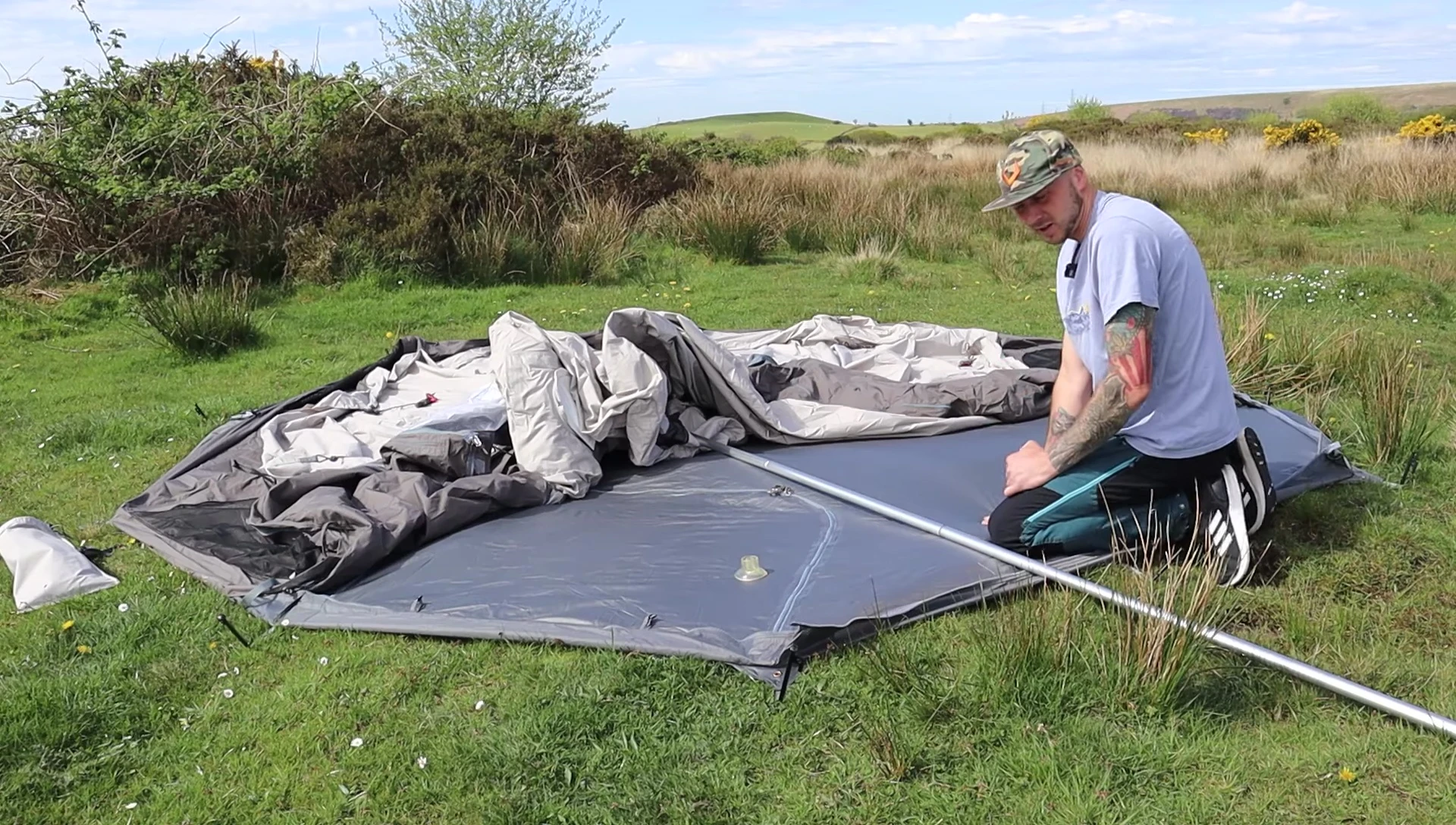 The tent poles being assembled and the tent starting to take shape.