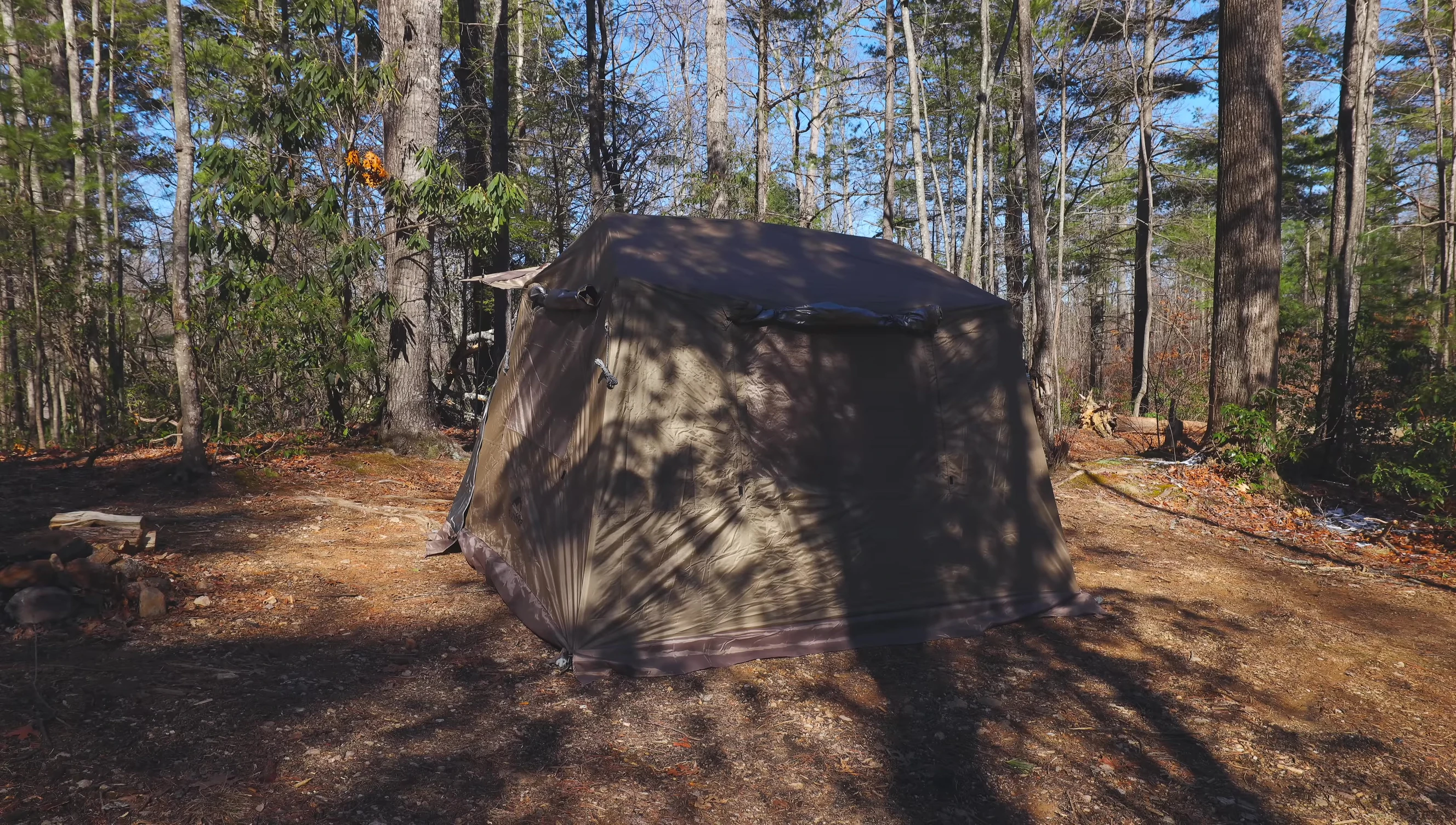 The tent set up in a camping location.