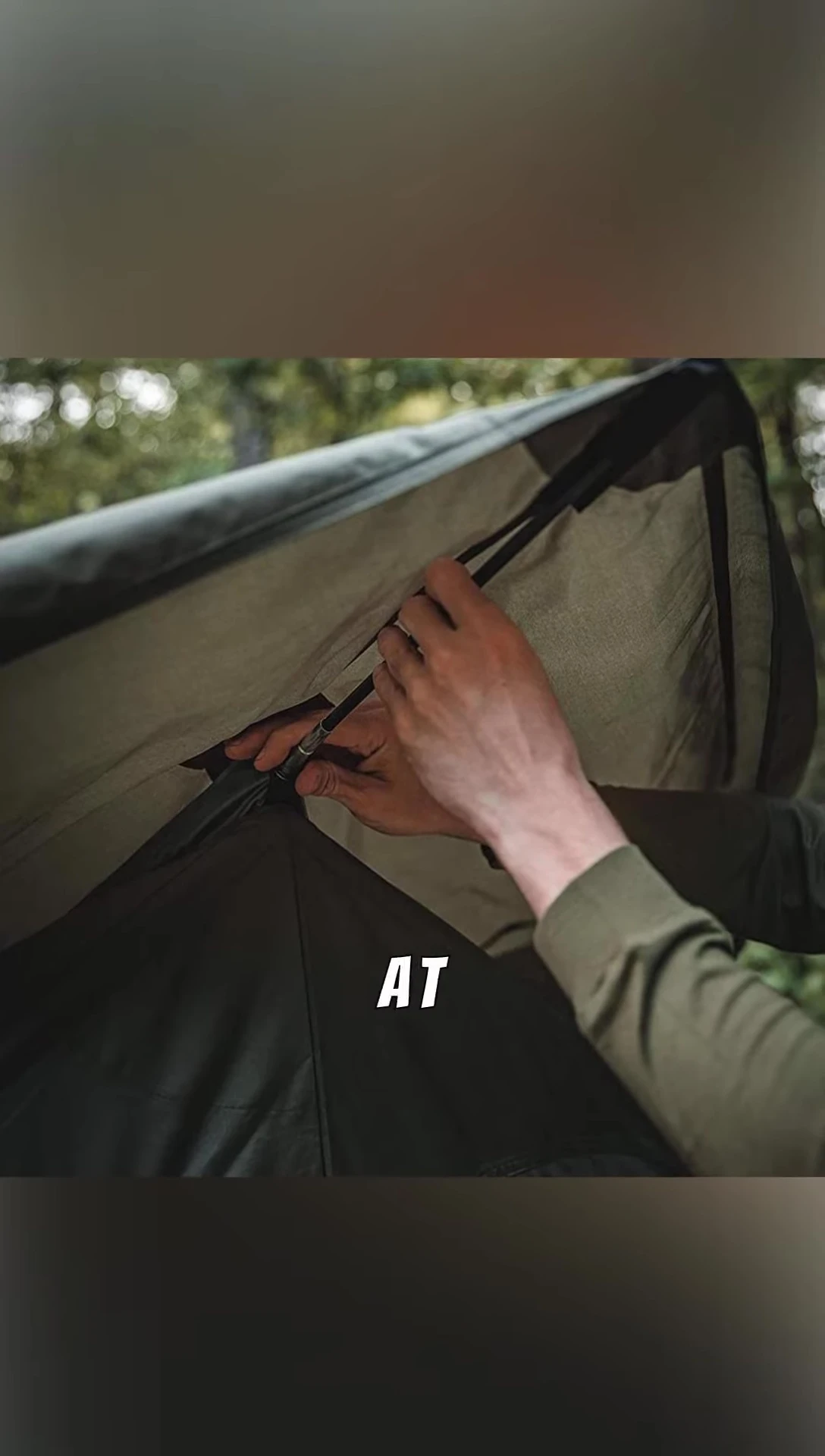 The tent being packed up, highlighting its portability.