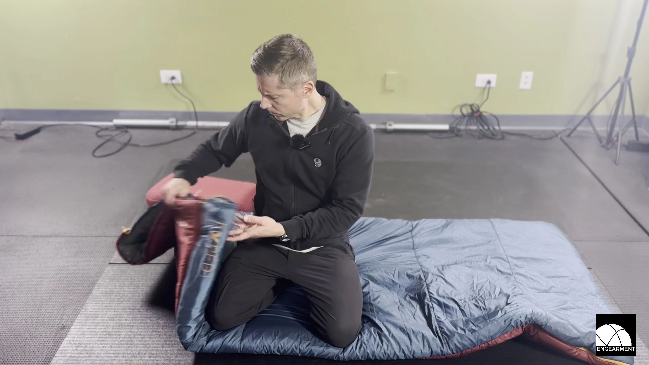 The MegaSleep Uno being shown with its storage bag.