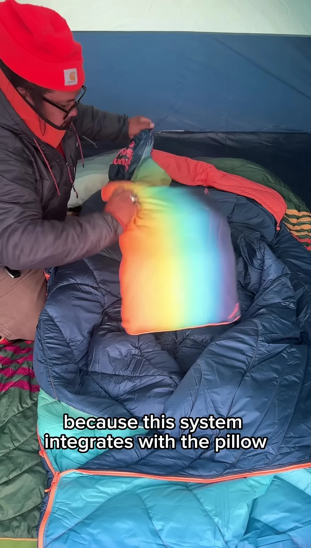 The reviewer demonstrating the integrated pillow system.