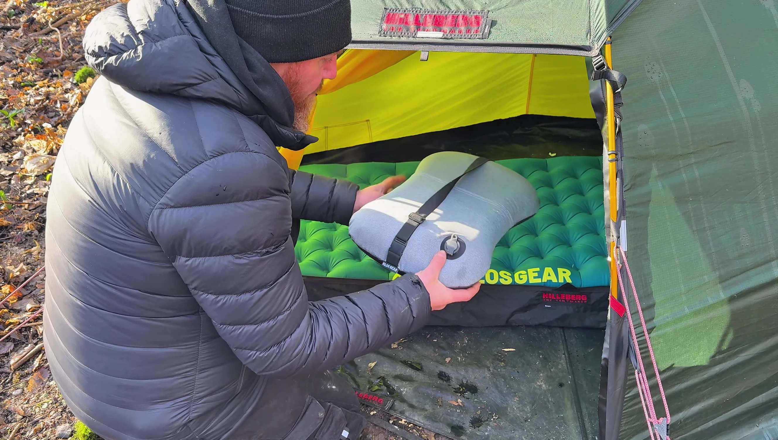 The reviewer demonstrating the pillow strapped to the mat