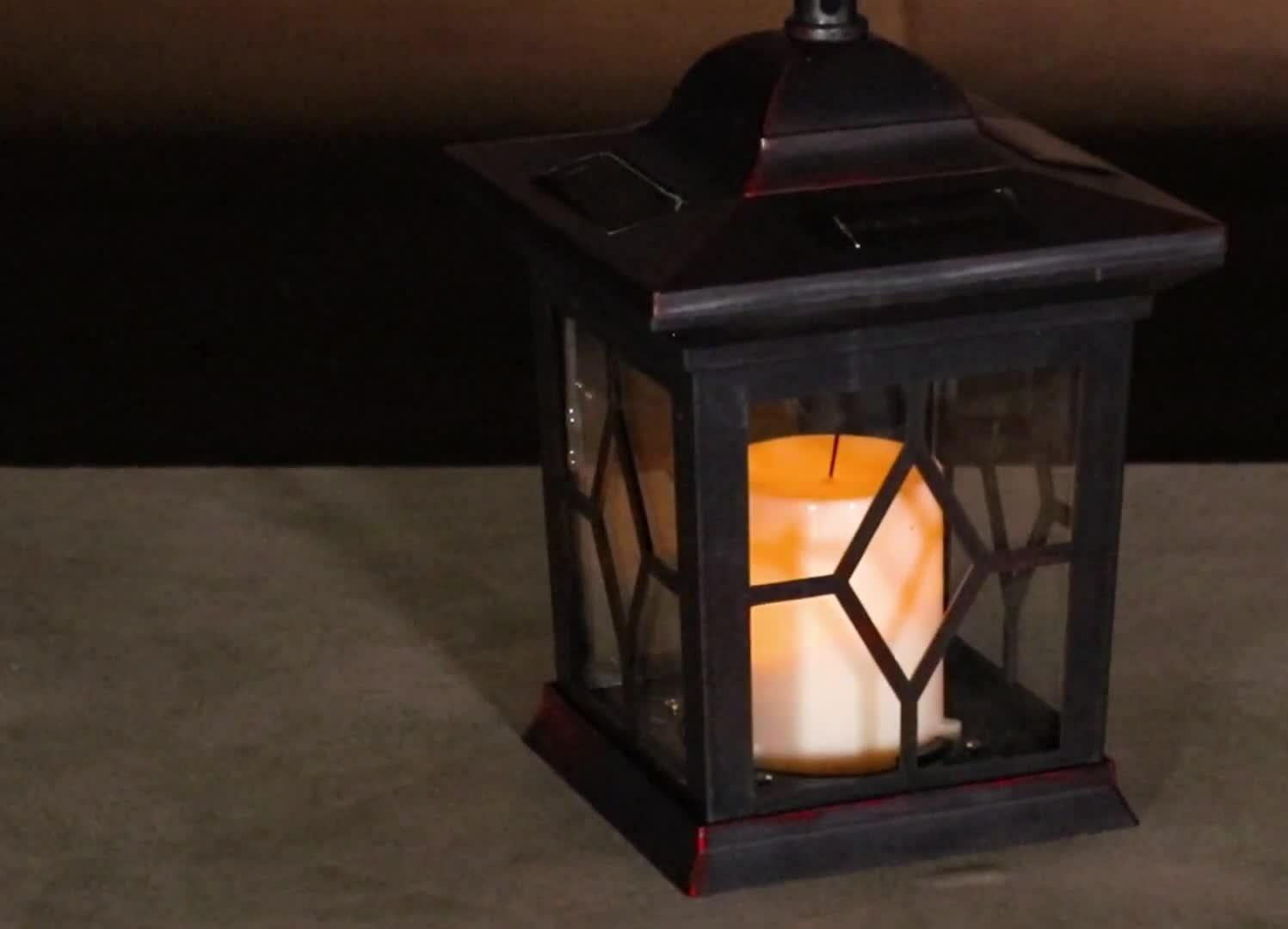 Hand touching the lantern to demonstrate its cool-to-the-touch feature.