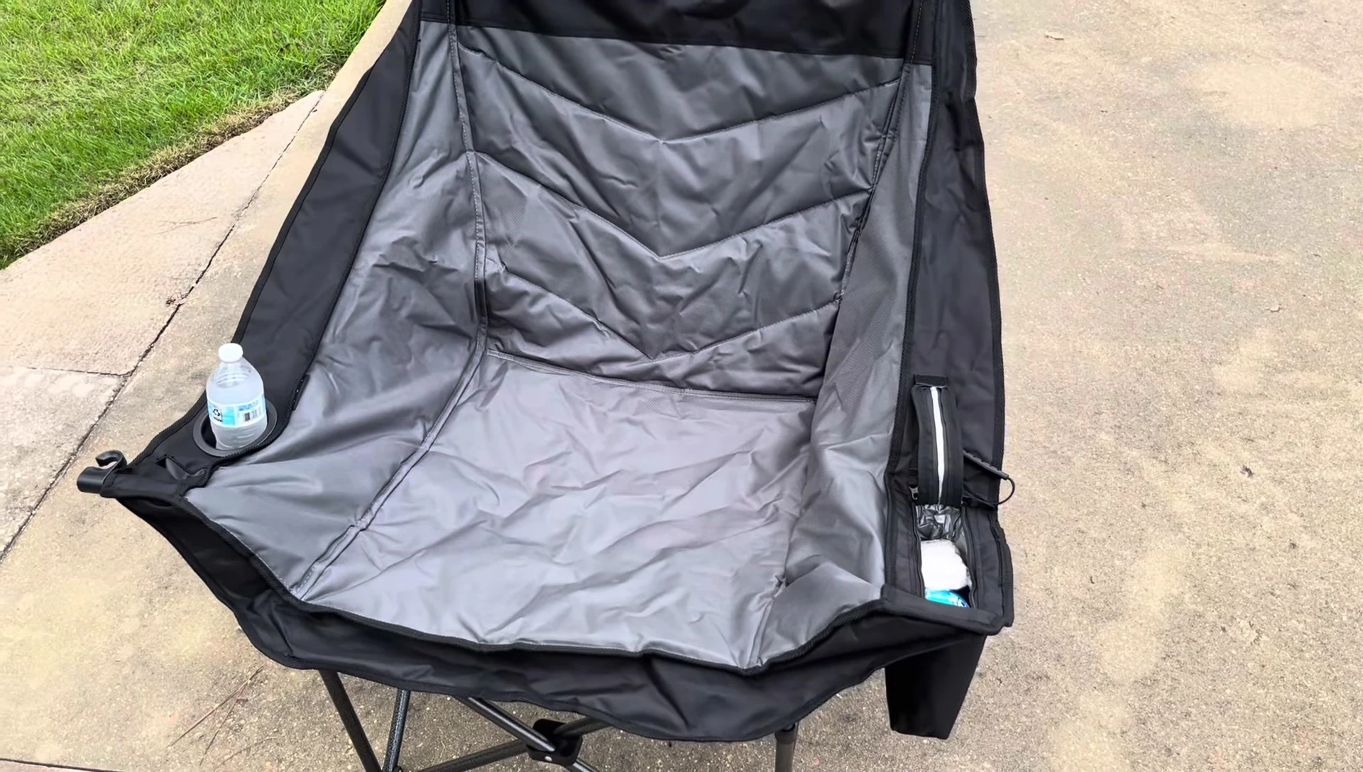 The reviewer sitting in the chair by the lake.