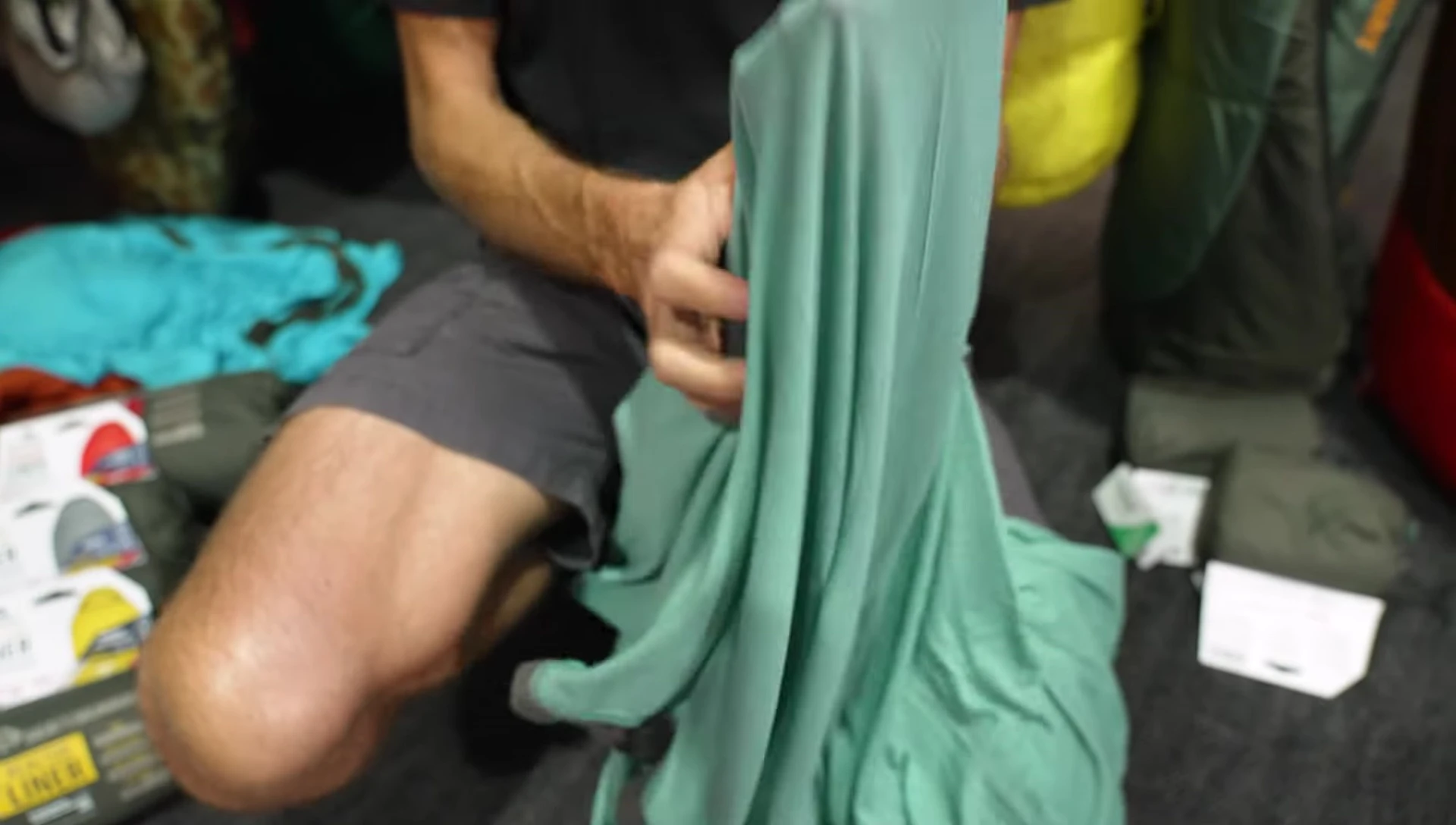 The presenter demonstrating the liner's softness