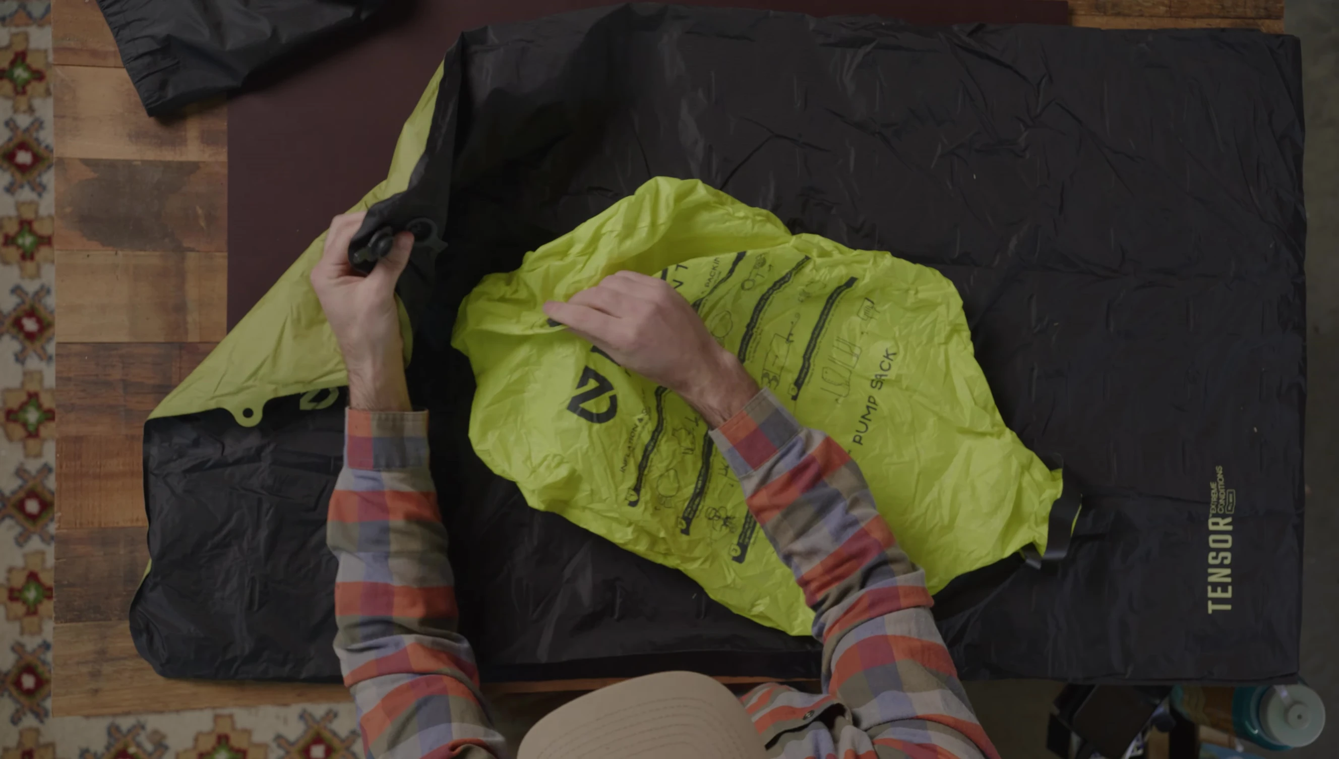 Attaching the pump sack to the sleeping pad