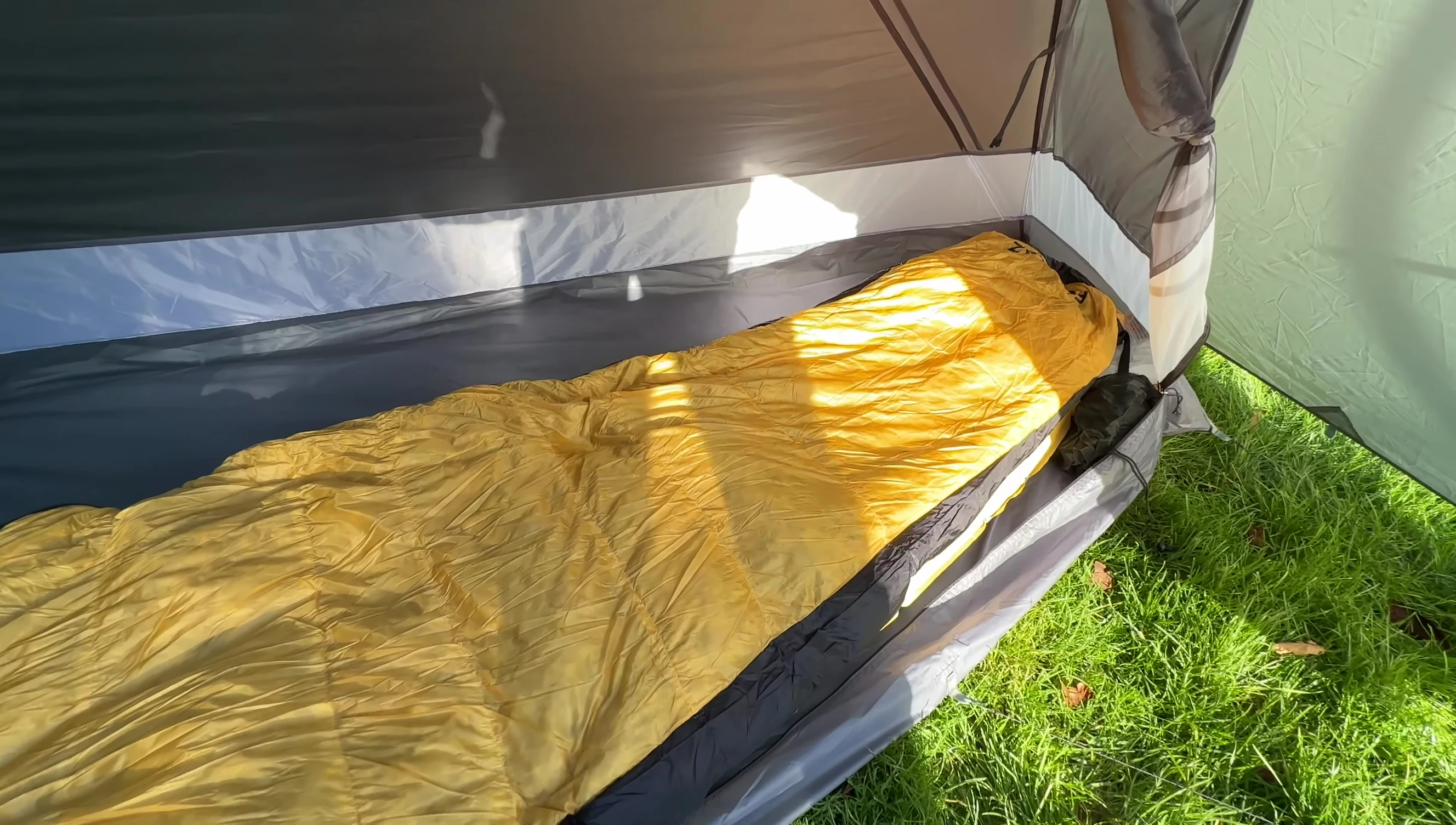 The sleeping pad with a sleeping bag on top.