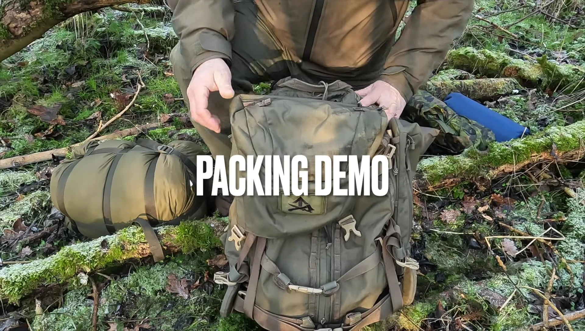 The sleeping bag being packed into a backpack.