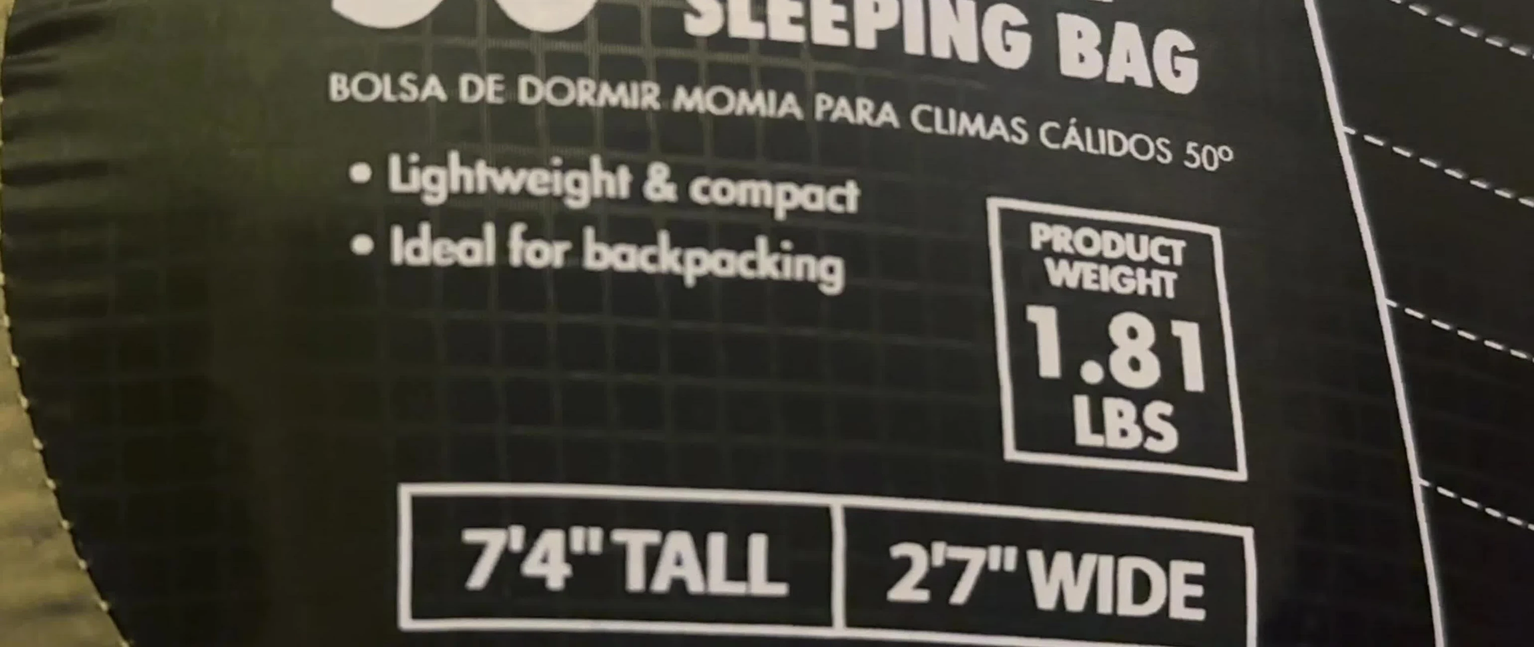 The reviewer showing the compact size of the sleeping bag.