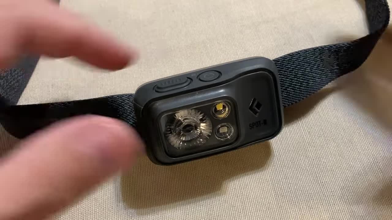 Close-up shot of the headlamp's two buttons