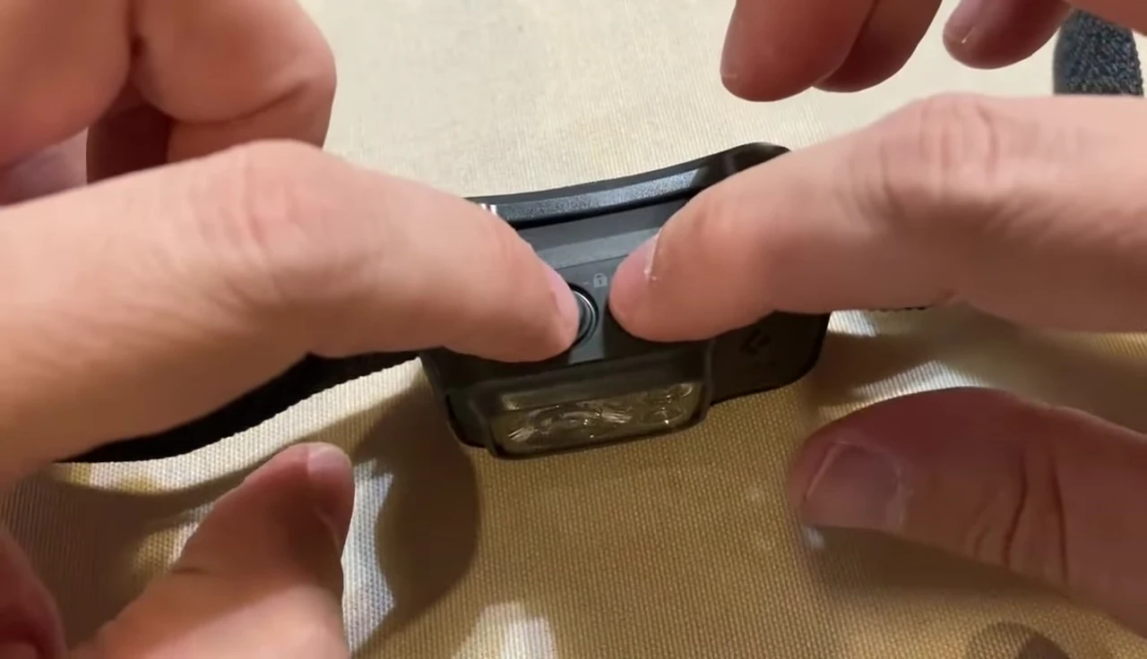 Holding both buttons to lock the headlamp