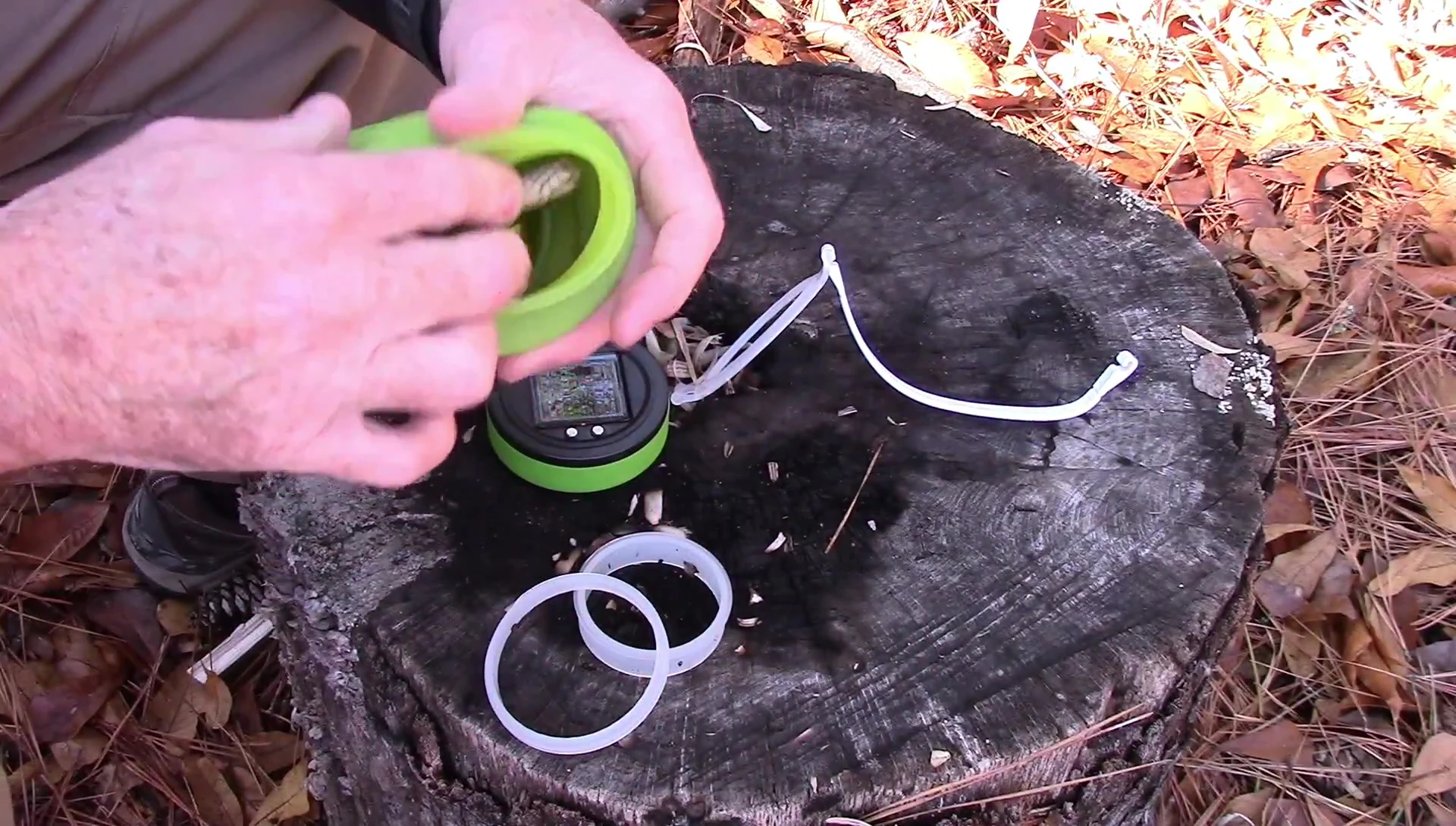 Demonstration of placing a phone inside the waterproof bottle.
