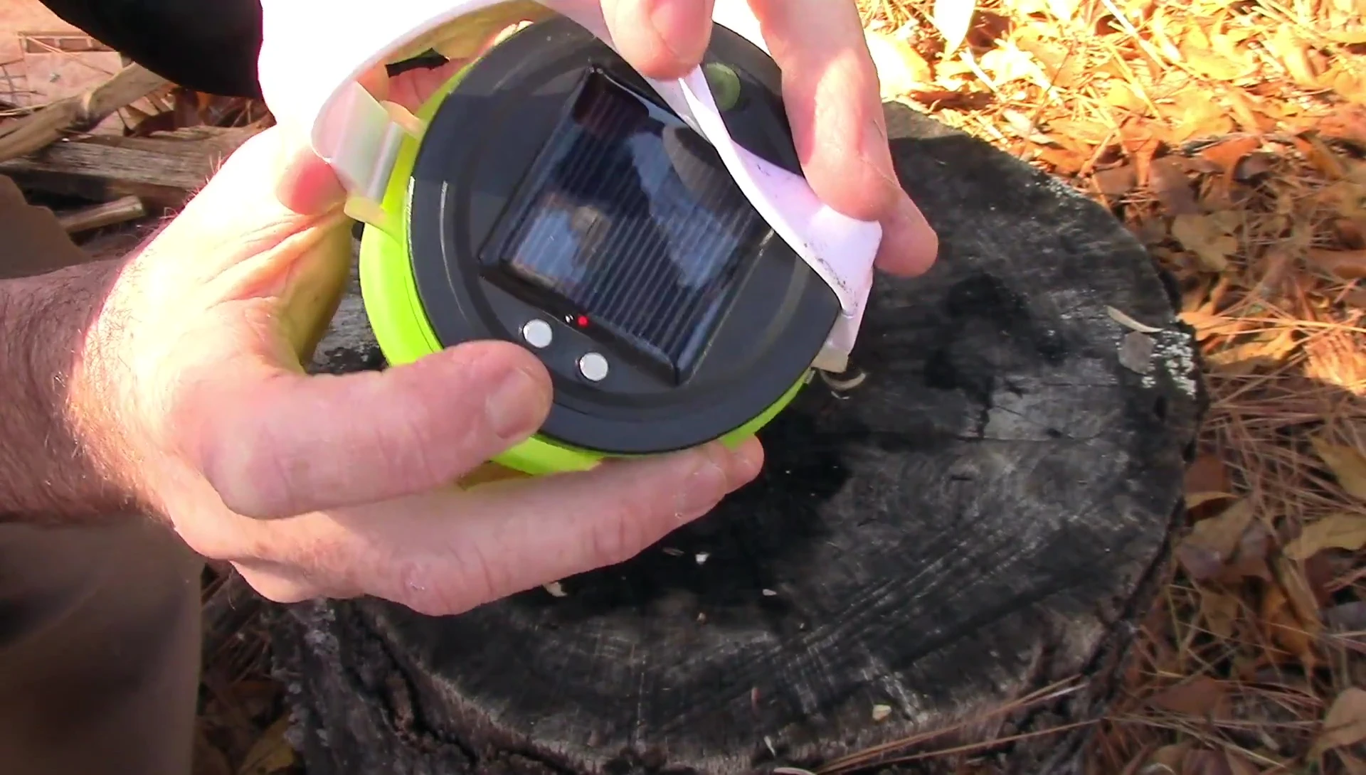 Close-up showing the charging indicator light on the lantern.