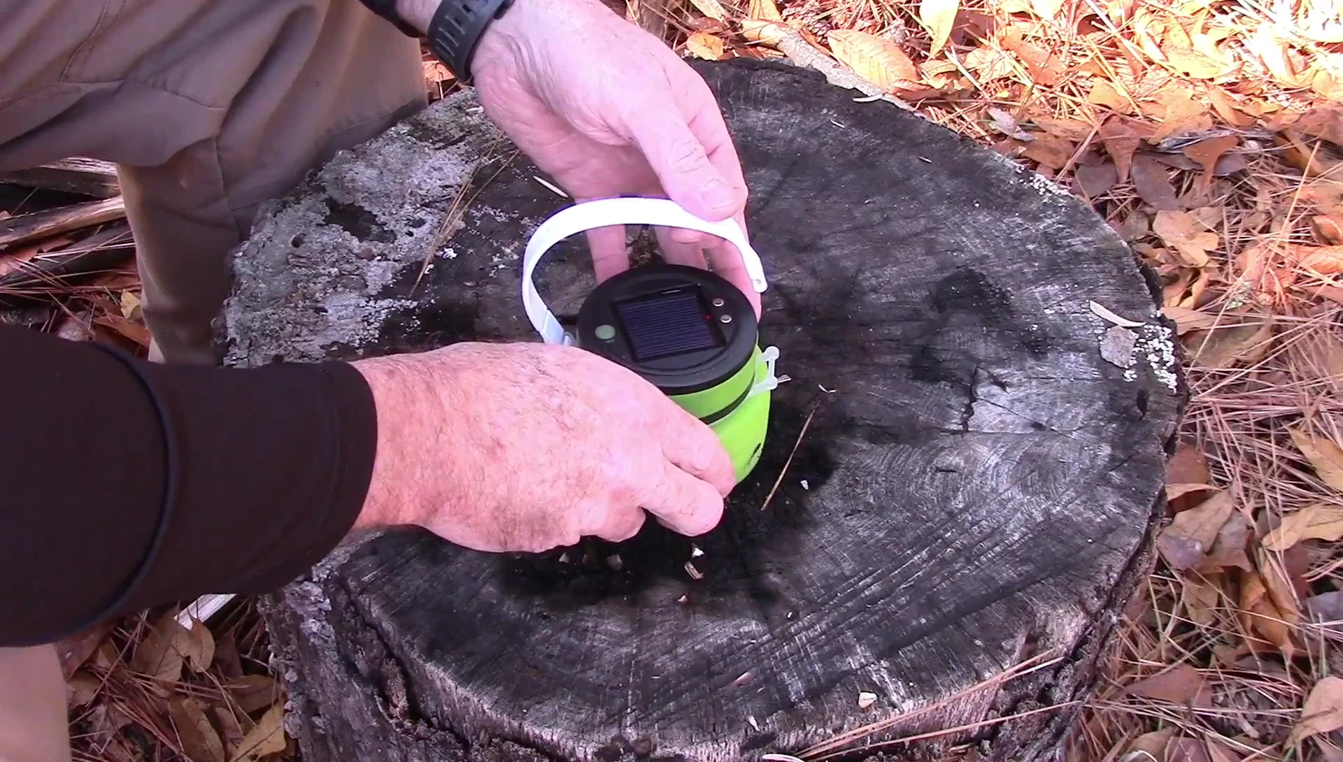 Close-up of the TREKK Solar Lantern showing its removable handle and compact size.