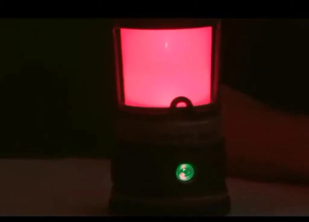 The Siege Lantern showcasing its red light mode.