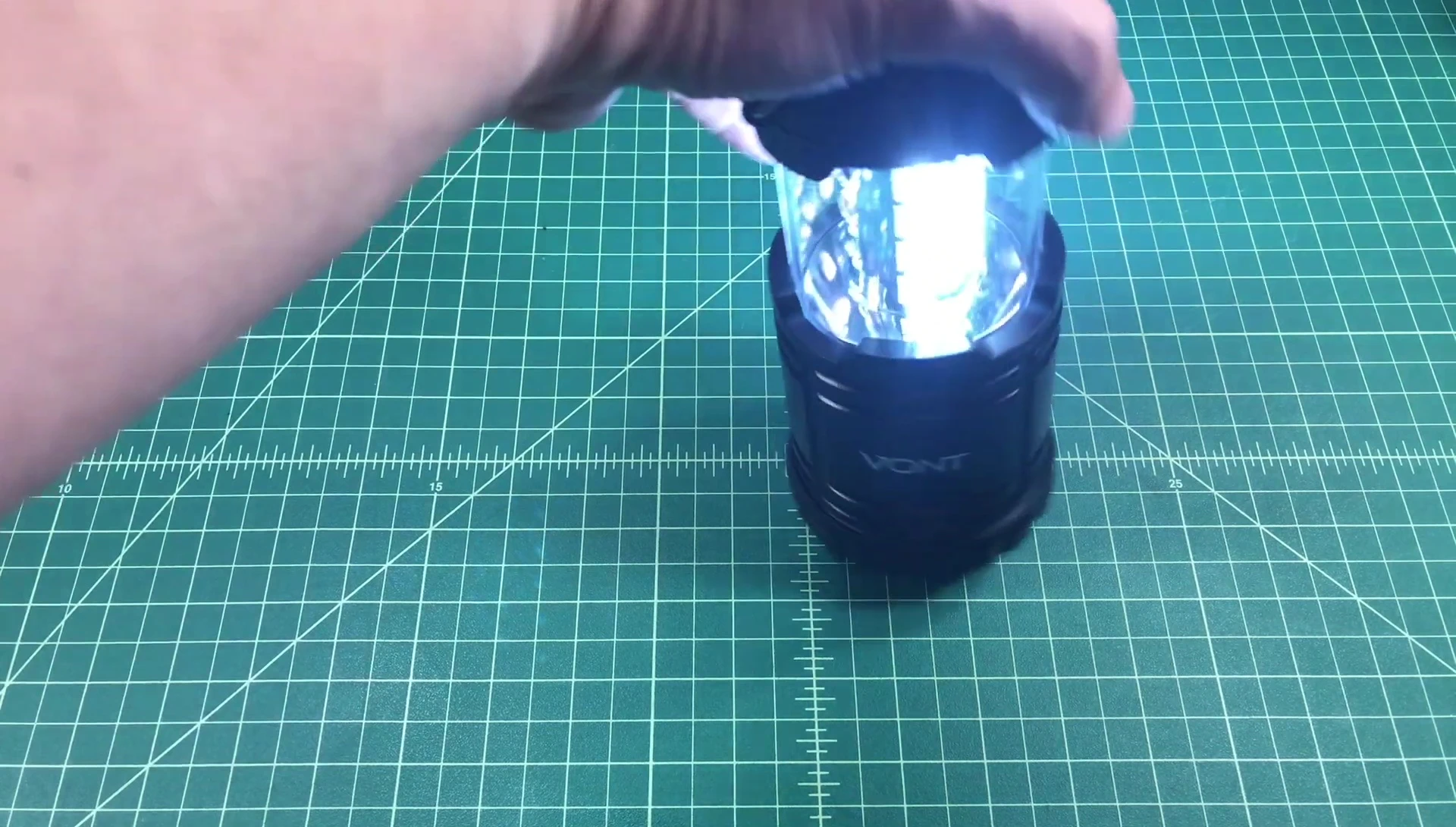 The lantern illuminating a dark area.