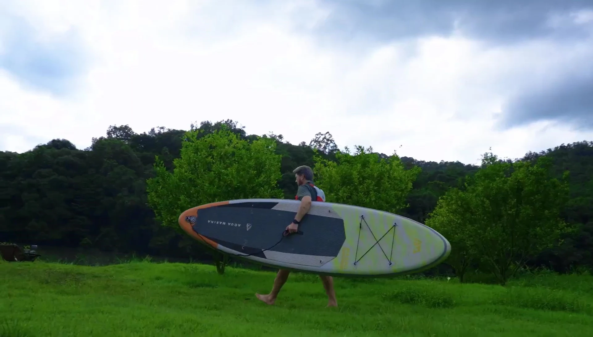 Person effortlessly setting up the OneTigris Tiger Blade camping chair.