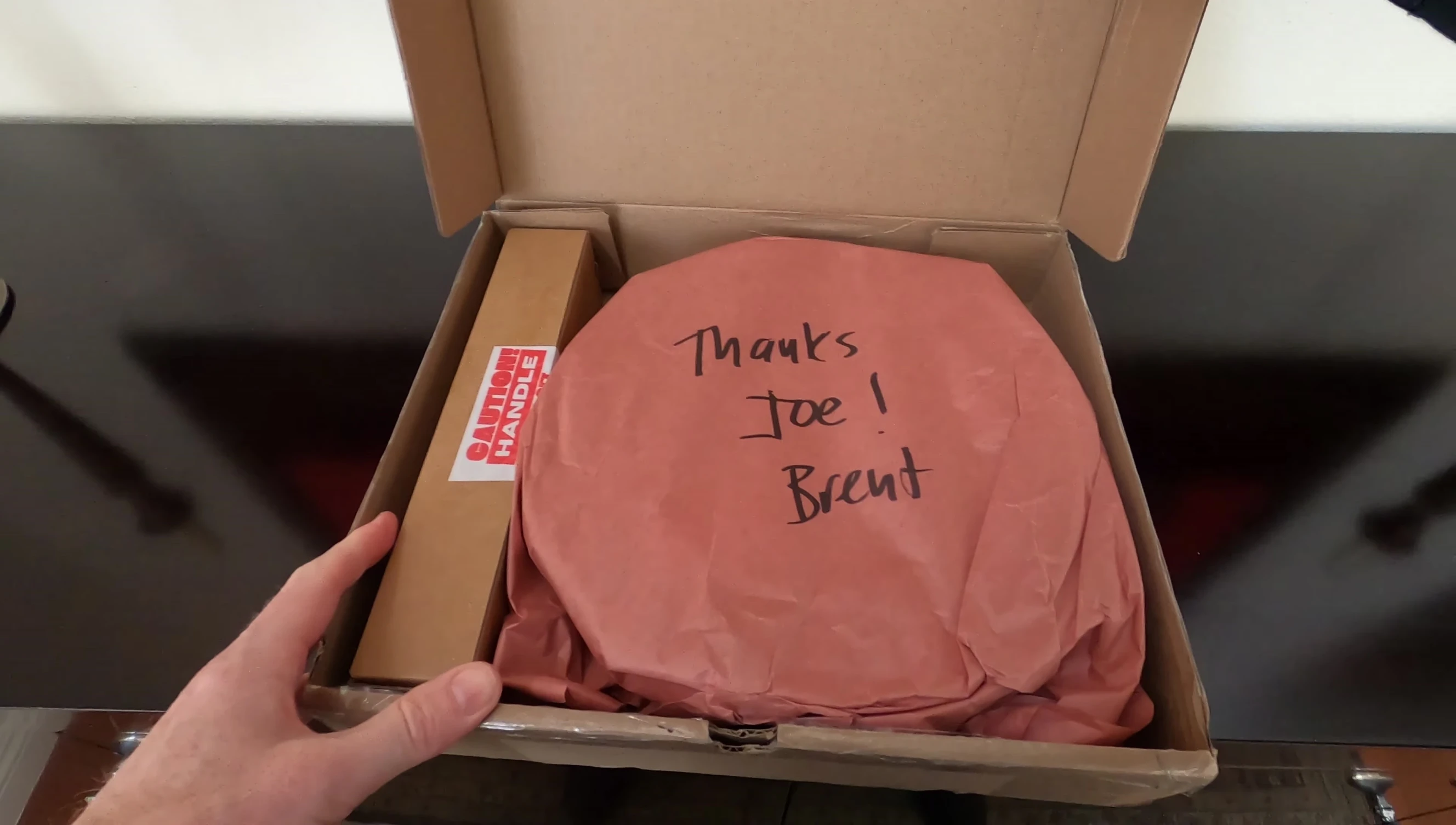 Close-up of the GOSO Cookware package with a personalized note.