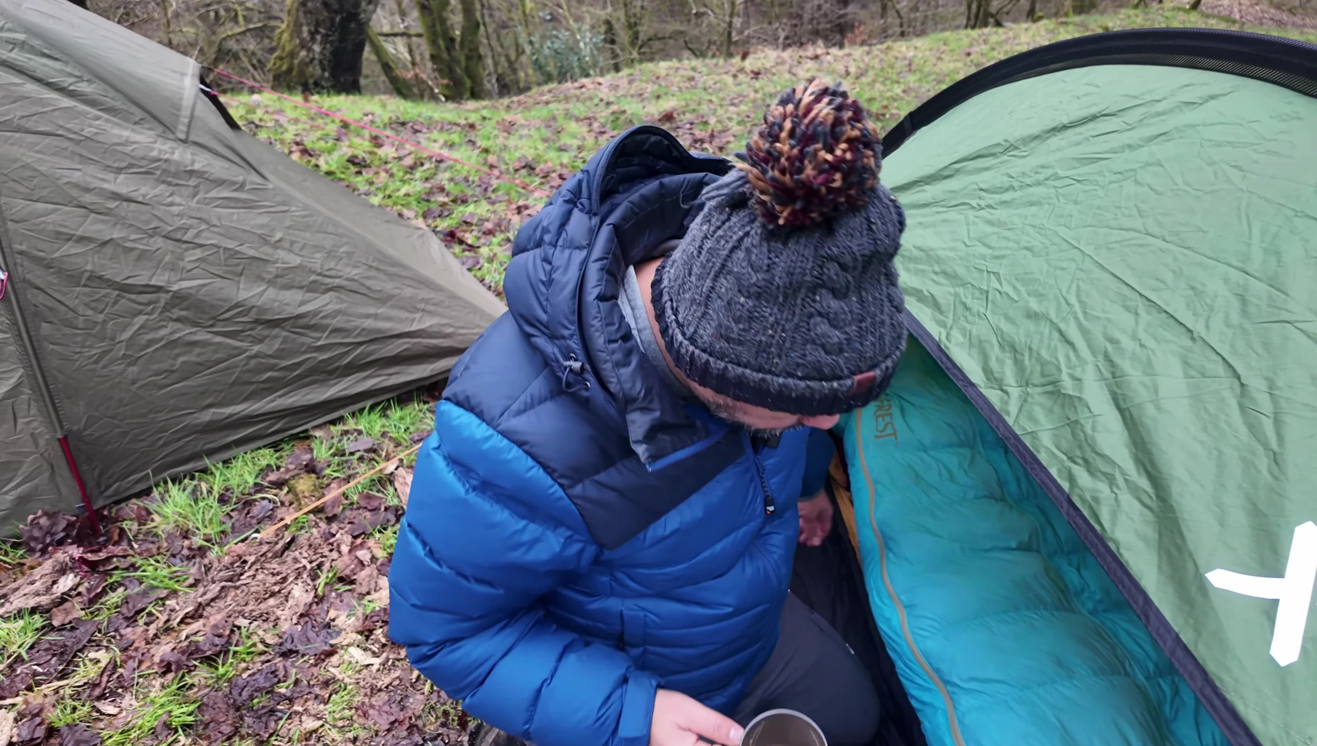 Detailed view of the sleeping bag showcasing zippers and other features.