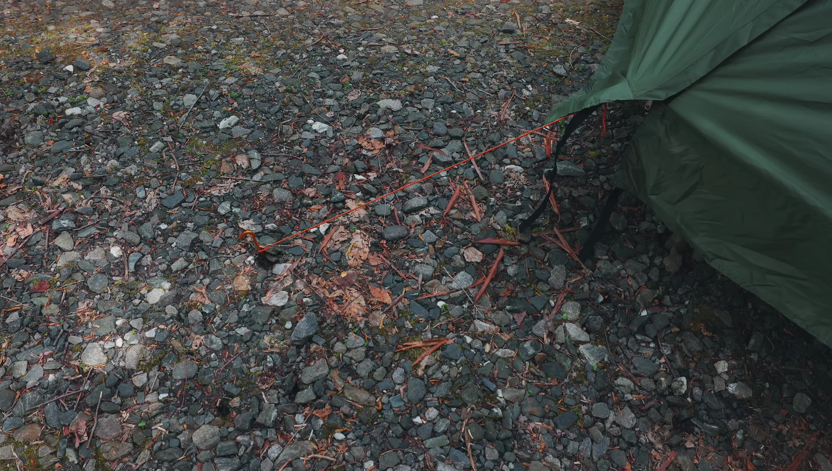Showing the straps attaching tent to cot