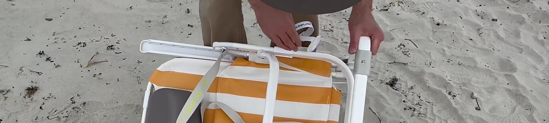 The reviewer demonstrating the backpack straps on the Sunflow chair.