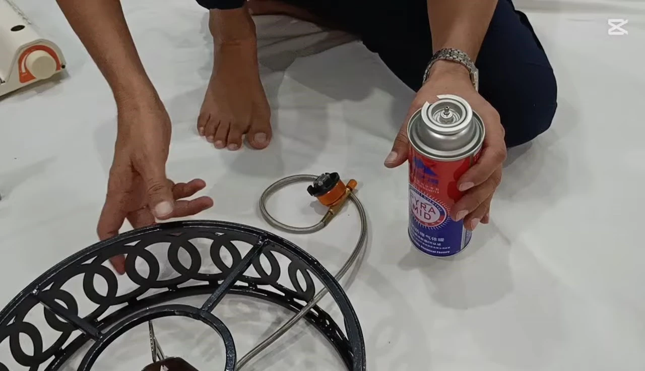 The camping stove in use, showcasing the flame.