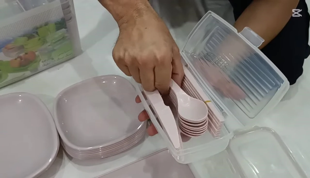 The cutlery and serving utensils included in the picnic set.