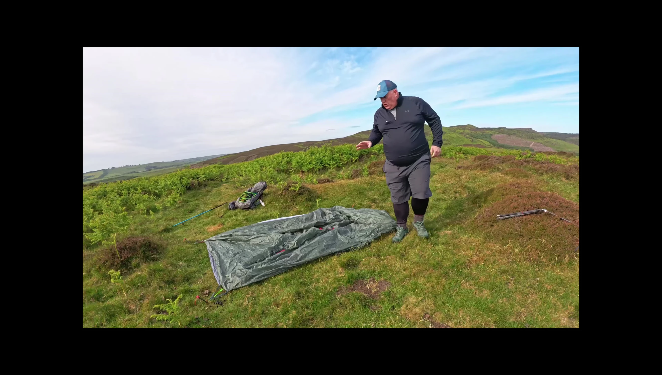 The tent partially pitched, highlighting the ease of setup.