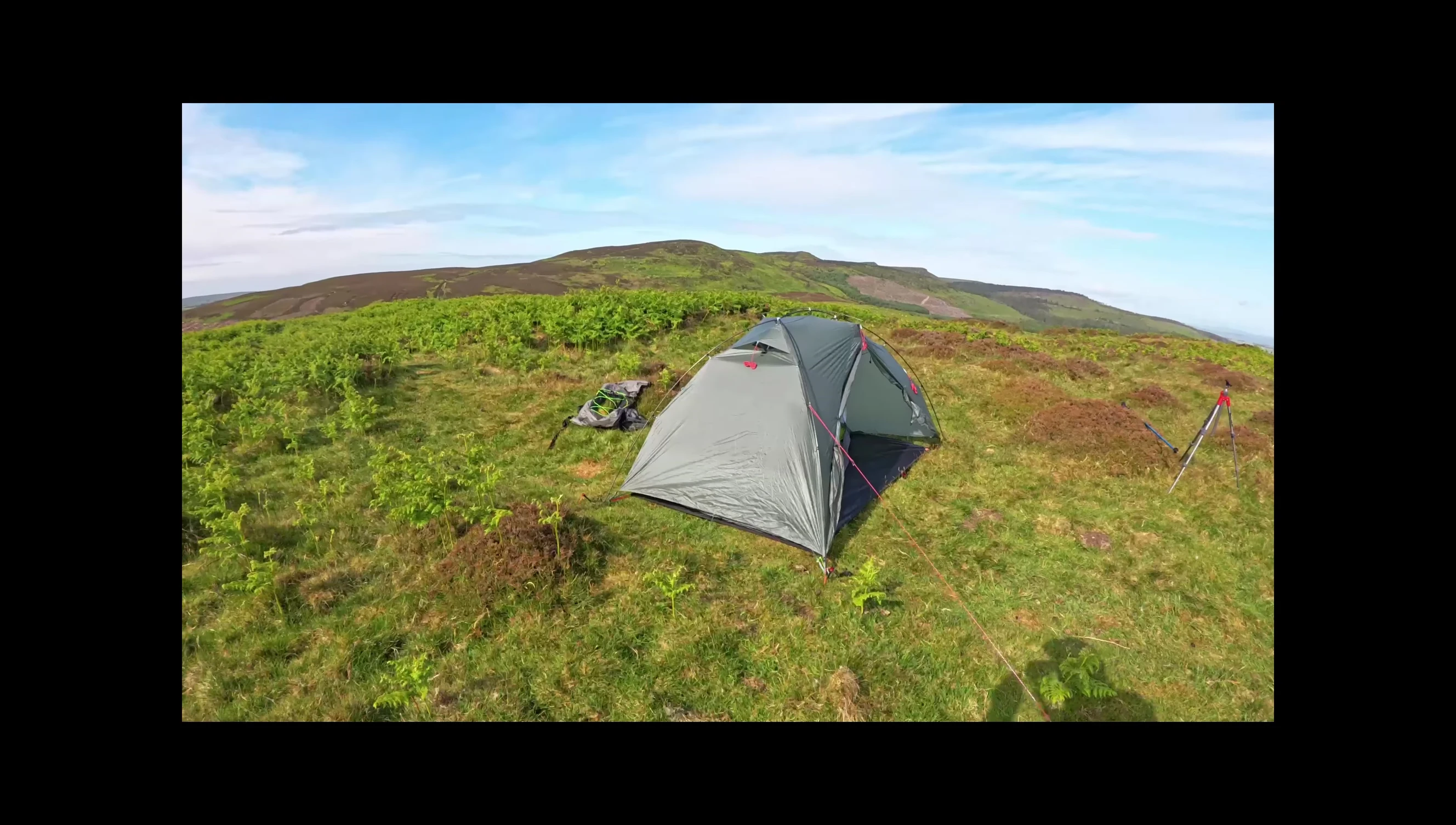 Final shot of the tent standing strong in a light breeze.