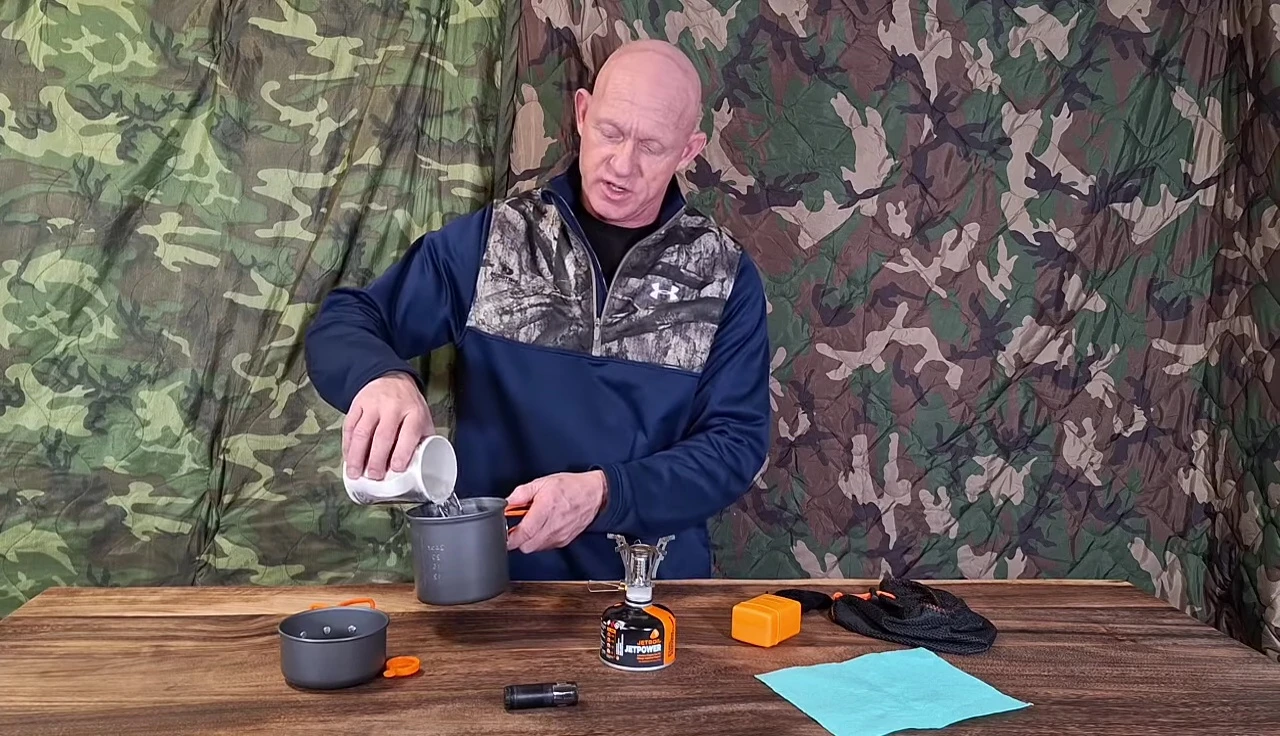 Pouring water into the pot for the boiling test.
