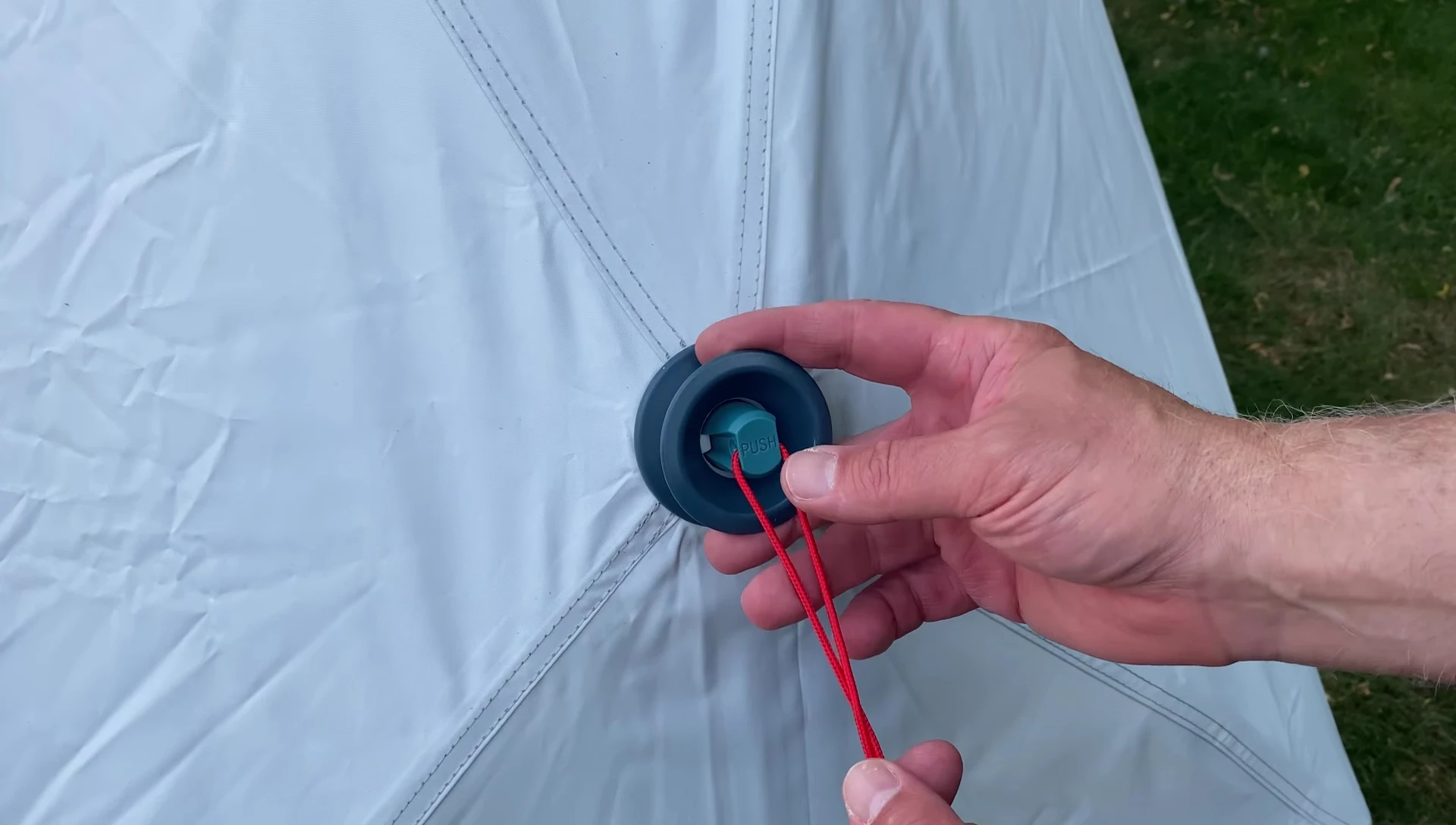 Button to collapse the tent