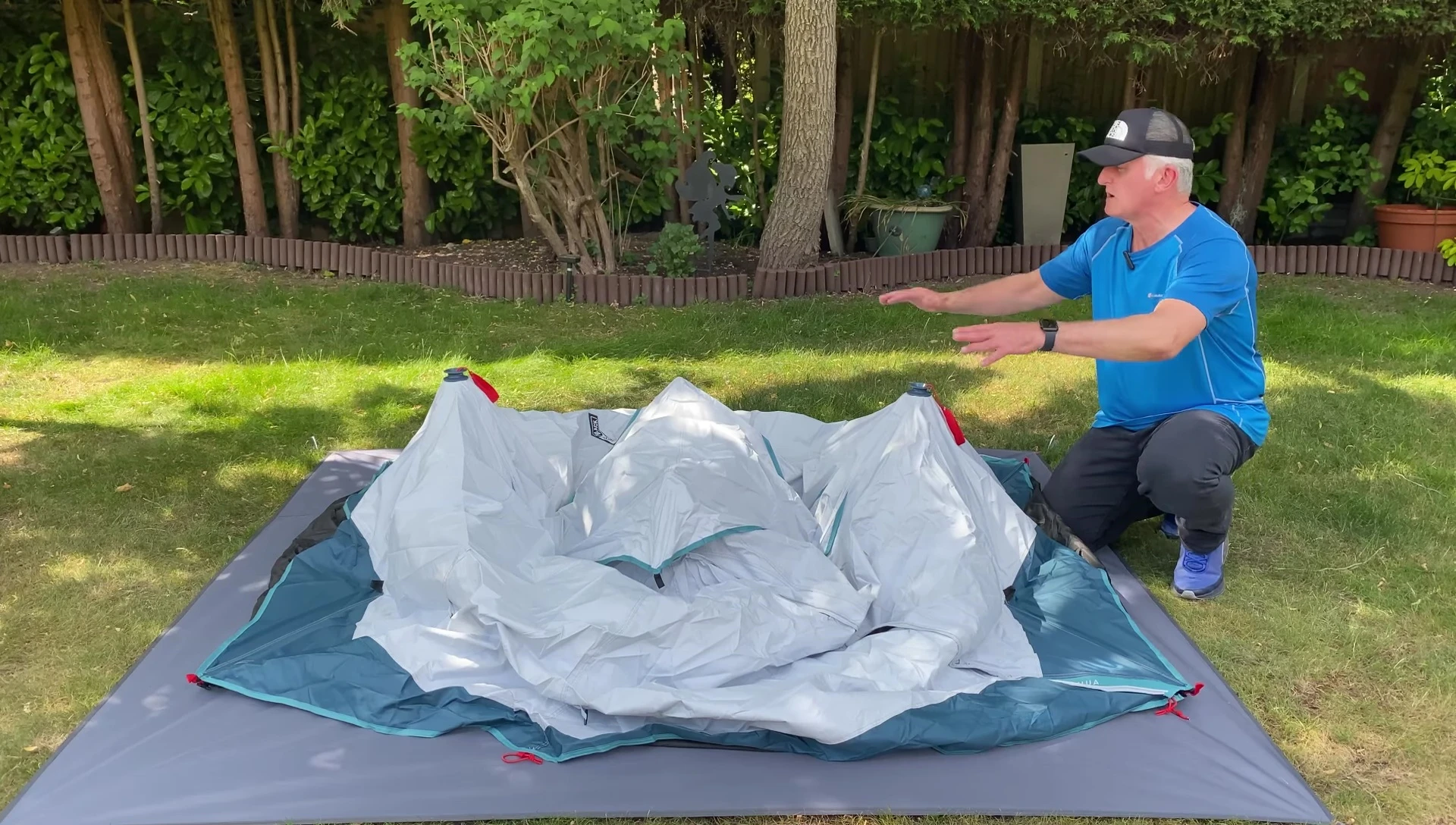 Setting up the Quechua 2 Seconds tent, showing the red cords