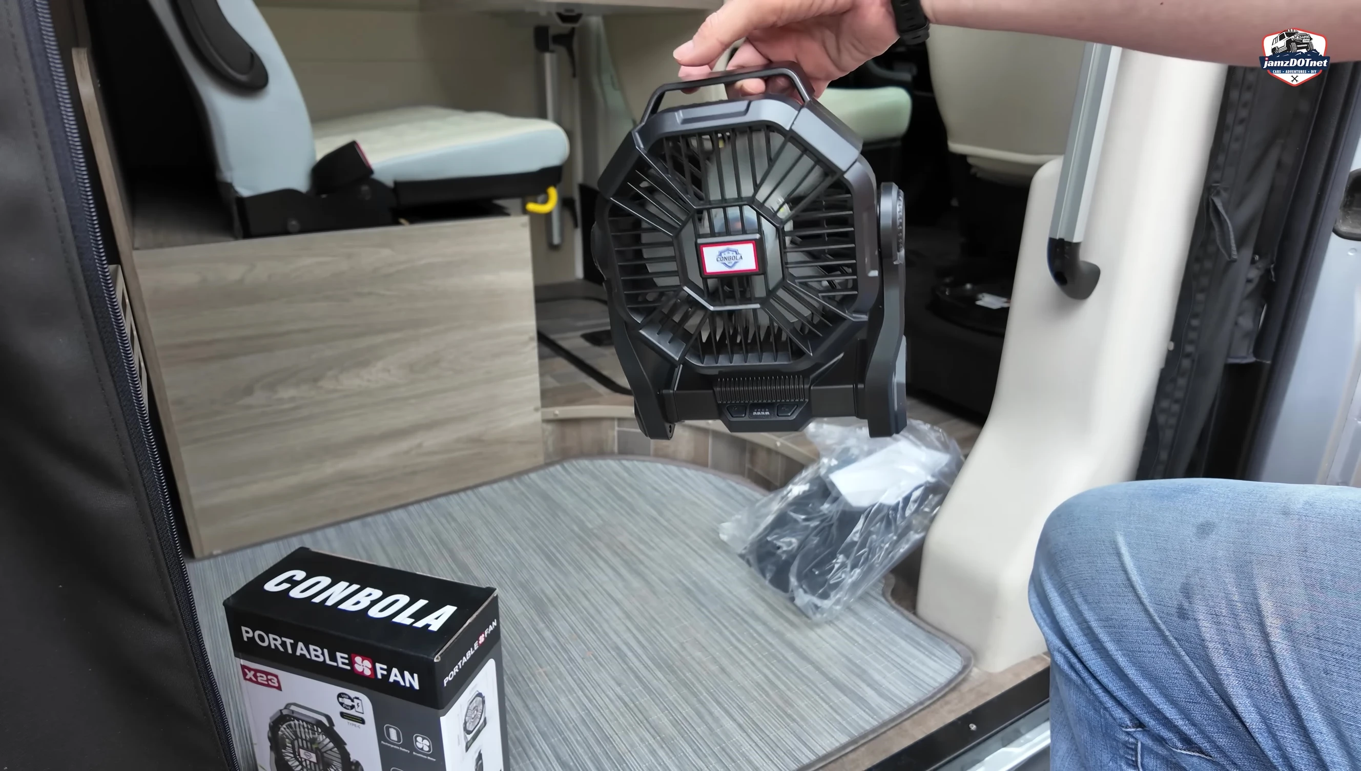 The fan hanging from a hook.