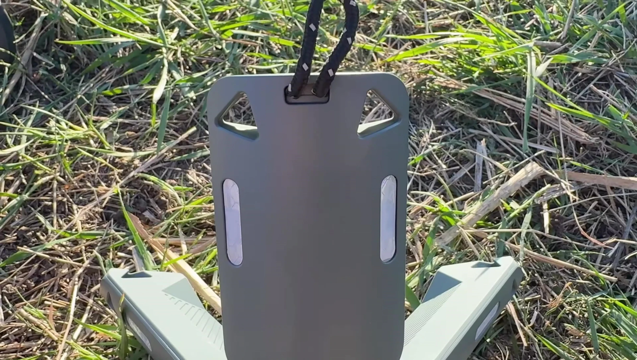 The hanger on the bottom of the light.