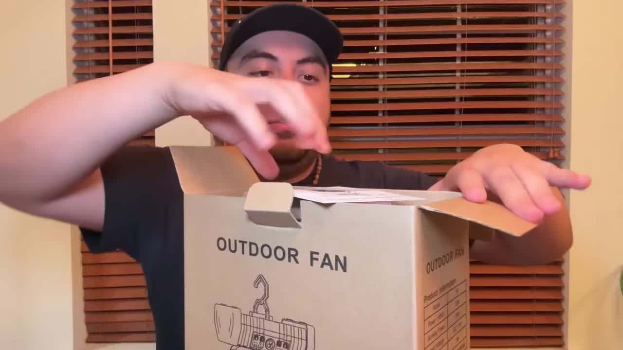 Unboxing the OGERY camping fan, showing the contents.